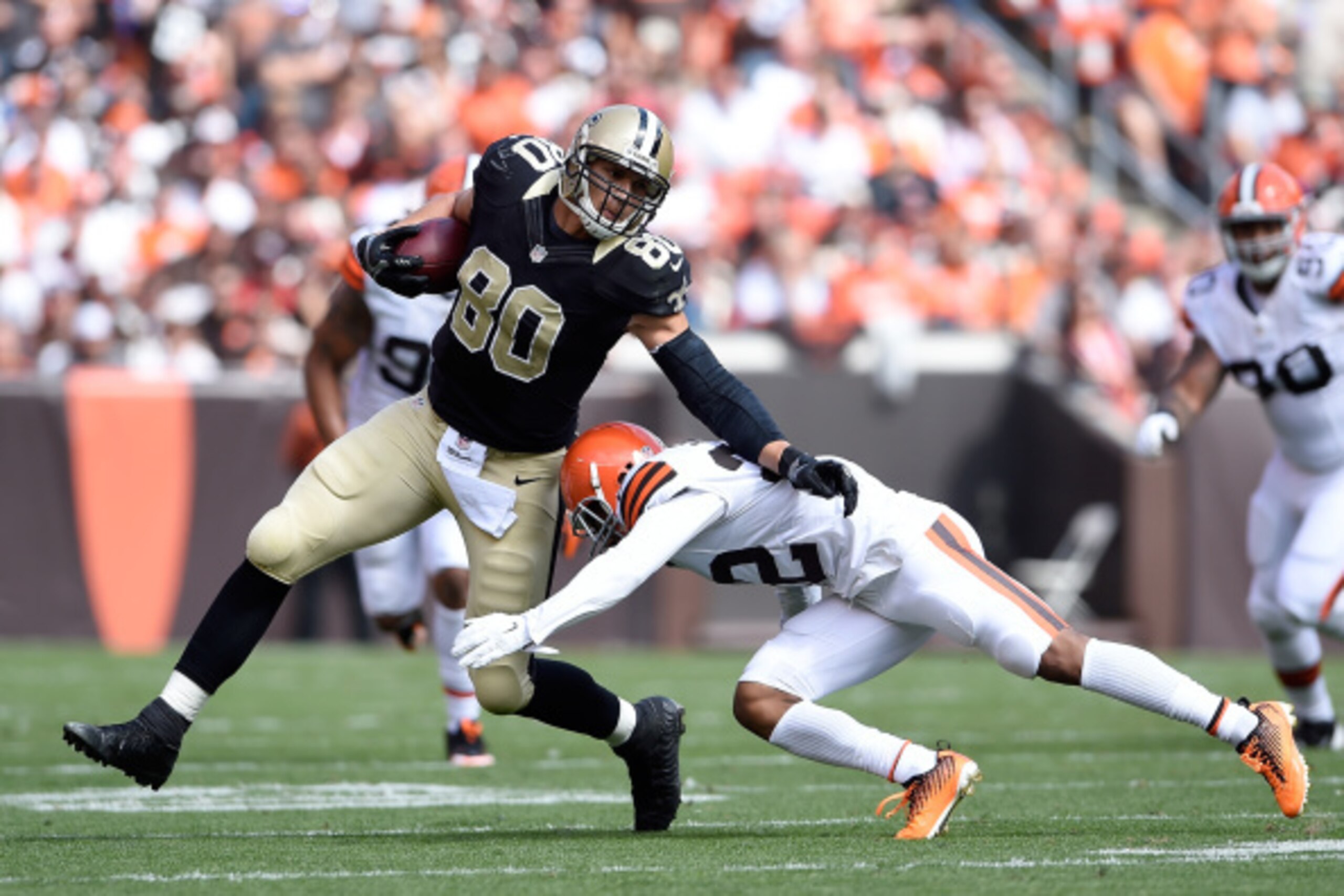 CLEVELAND, OH - SEPTEMBER 14:  Jimmy Graham #80 of the New Orleans Saints avoids a tackle by Buster Skrine #22 of the Cleveland Browns during the second quarter at FirstEnergy Stadium on September 14, 2014 in Cleveland, Ohio.  (Photo by Jason Miller/Getty