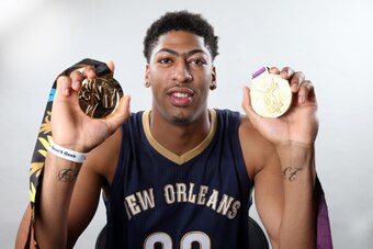 METAIRIE, LA - SEPTEMBER 17:  Anthony Davis of the New Orleans Pelicans shows off his two gold medals after helping USA Basketball win the 2014 FIBA World Cup in Spain on September 17, 2014 at the New Orleans Pelicans practice facility in Metairie, Louisi
