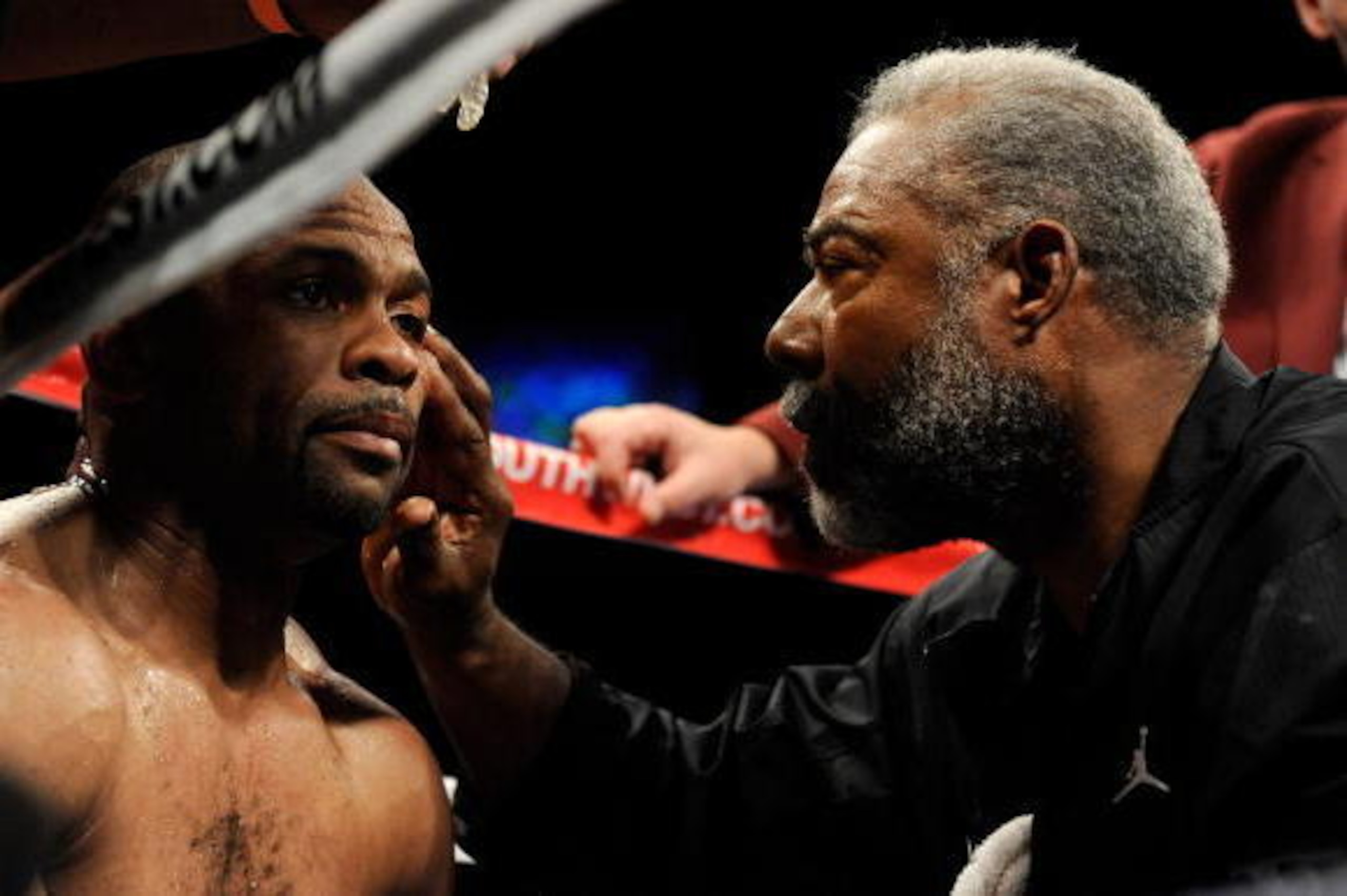 LAS VEGAS - APRIL 03:  Roy Jones Jr. (L) is tended to by his trainer Alton Merkerson in Jones' corner between rounds of his light heavyweight bout against Bernard Hopkins at the Mandalay Bay Events Center April 3, 2010 in Las Vegas, Nevada. Hopkins won by