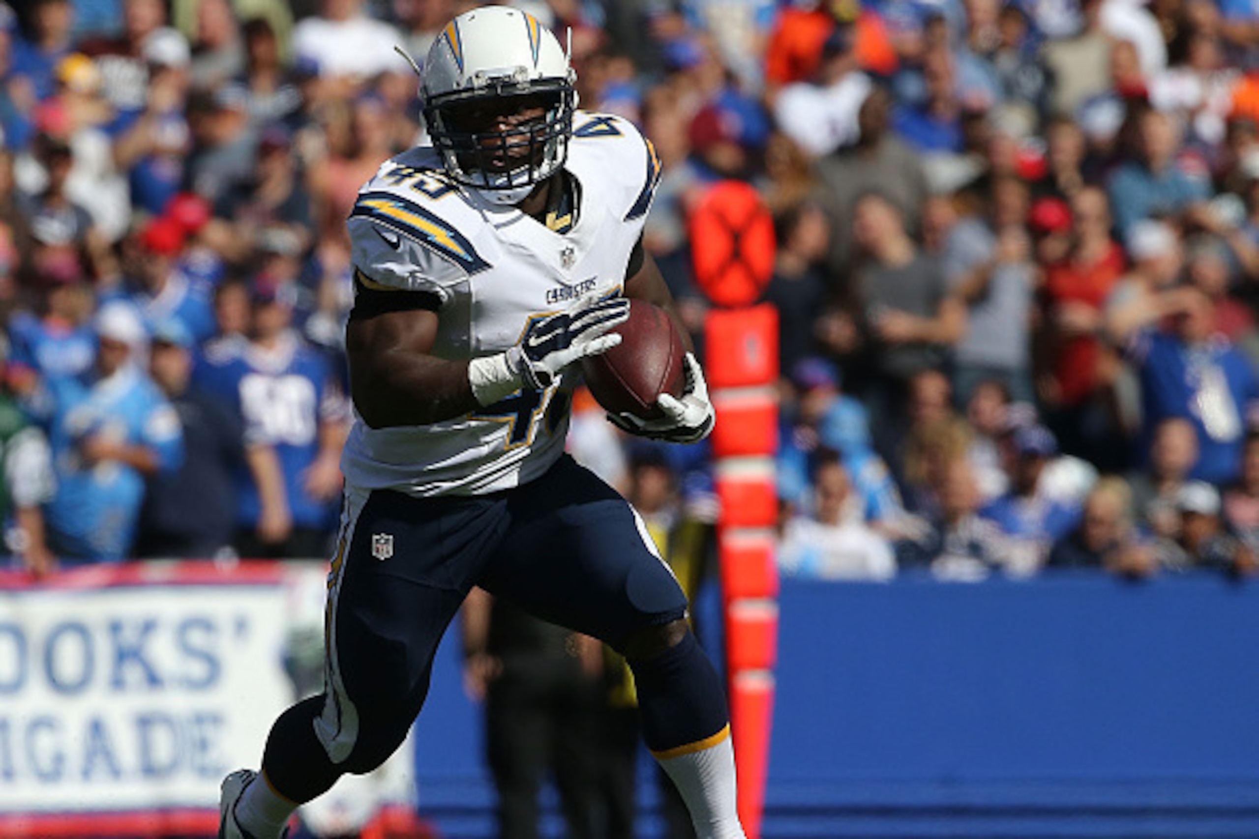 ORCHARD PARK, NY - SEPTEMBER 21:  Branden Oliver #43 of the San Diego Chargers runs the ball against the Buffalo Bills during the second half at Ralph Wilson Stadium on September 21, 2014 in Orchard Park, New York.  (Photo by Tom Szczerbowski/Getty Images