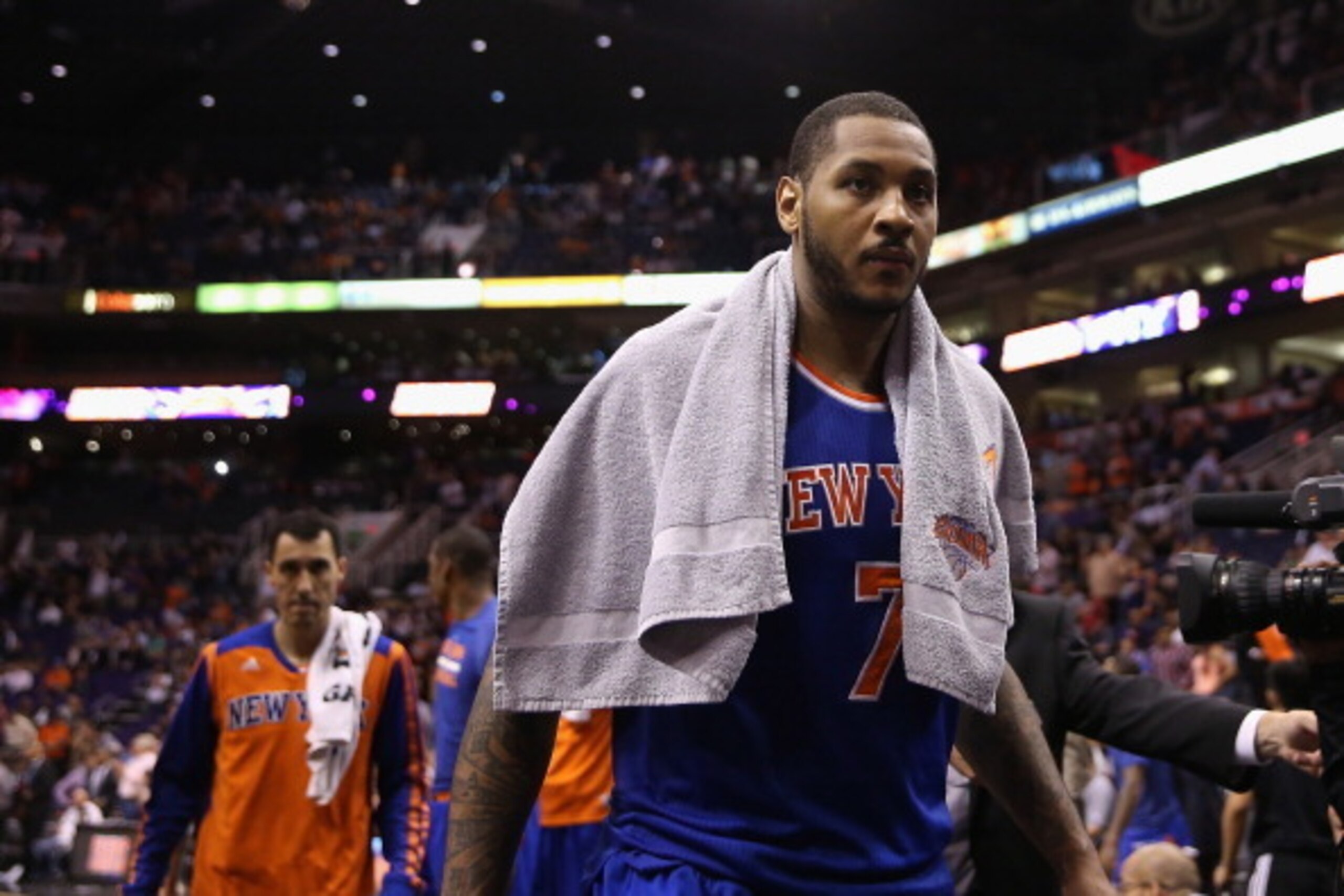 PHOENIX, AZ - MARCH 28:  Carmelo Anthony #7 of the New York Knicks walks off the court following the NBA game against the Phoenix Suns at US Airways Center on March 28, 2014 in Phoenix, Arizona.  The Suns defeated the Knicks 112-88. NOTE TO USER: User exp