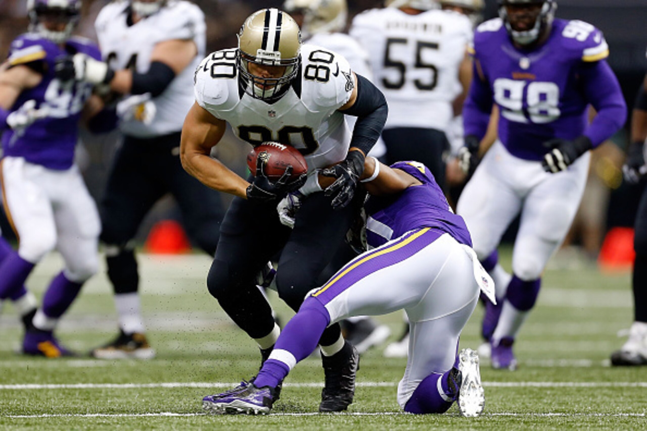 NEW ORLEANS, LA - SEPTEMBER 21:  Jimmy Graham #80 of the New Orleans Saints avoids a tackle by Josh Robinson #21 of the Minnesota Vikings during the first quarter of a game at the Mercedes-Benz Superdome on September 21, 2014 in New Orleans, Louisiana.  (