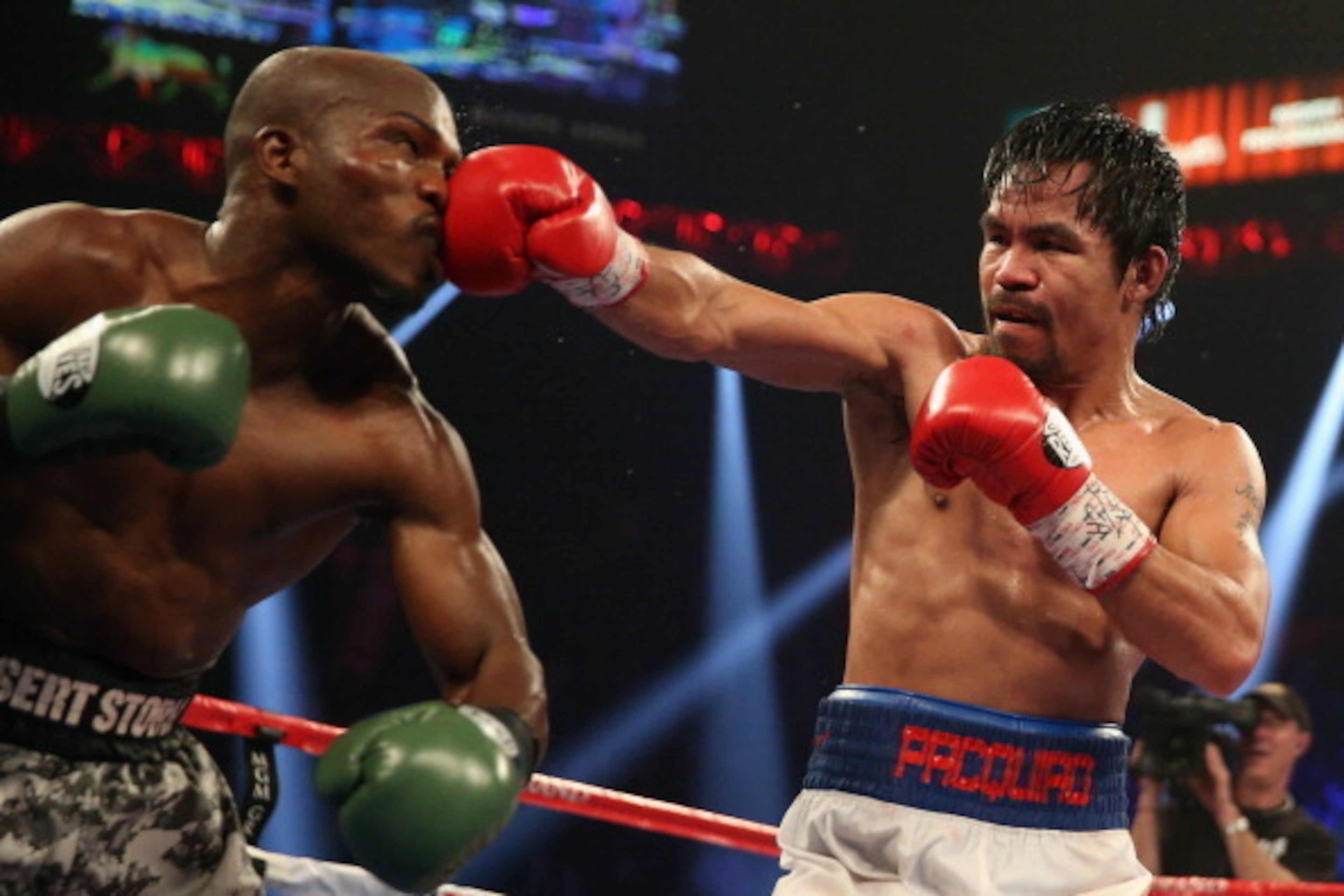 LAS VEGAS, NV - APRIL 12:  Manny Pacquiao throws a right hand at Timothy Bradley at the MGM Grand Garden Arena on April 12, 2014 in Las Vegas, Nevada.  (Photo by Jeff Gross/Getty Images)
