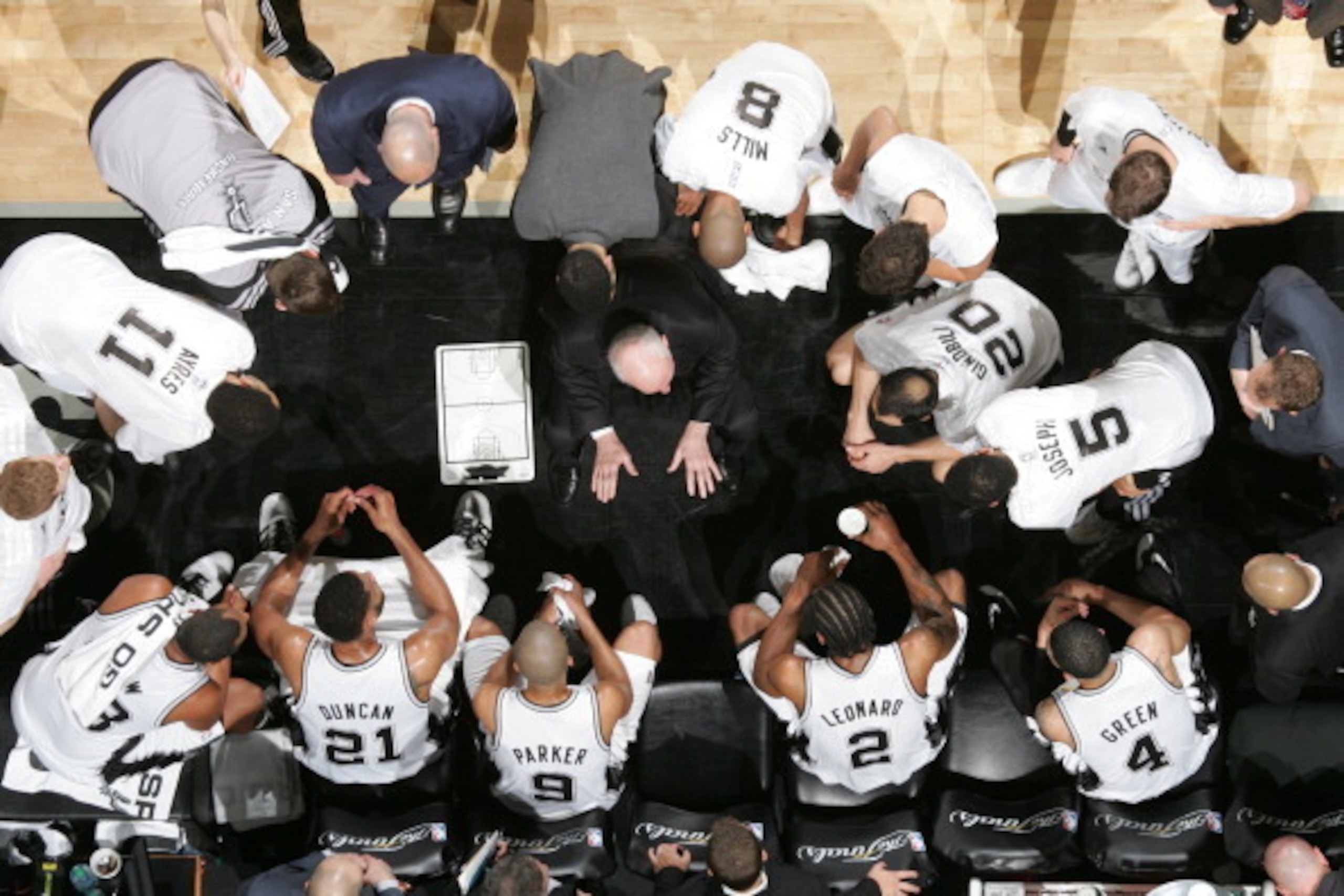 SAN ANTONIO, TX - JUNE 15: Gregg Popovich of the San Antonio Spurs directs his team in a huddle during Game Five of the 2014 NBA Finals against the Miami Heat at AT&T Center on June 15, 2014 in San Antonio, Texas. NOTE TO USER: User expressly acknowledges