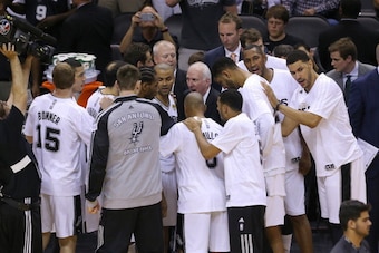 SAN ANTONIO, TX - JUNE 15:  Head coach Gregg Popovich of the San Antonio Spurs talks to his team as they defeat the Miami Heat in Game Five of the 2014 NBA Finals at the AT&T Center on June 15, 2014 in San Antonio, Texas. NOTE TO USER: User expressly ackn