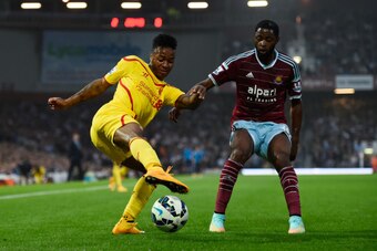 LONDON, ENGLAND - SEPTEMBER 20:  Raheem Sterling of Liverpool is challenged by Alexandre Song of West Ham during the Barclays Premier League match between West Ham United and Liverpool at Boleyn Ground on September 20, 2014 in London, England.  (Photo by 