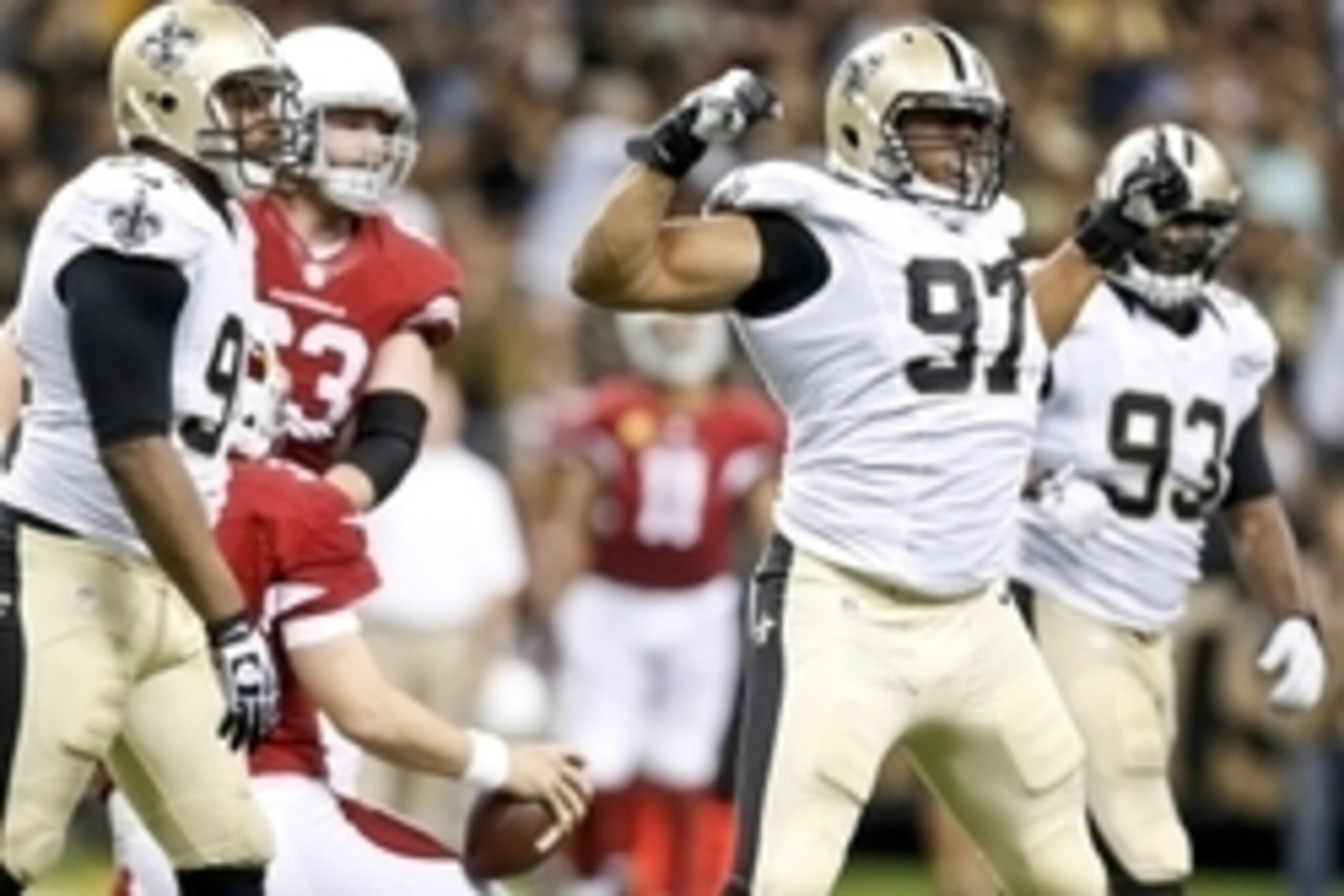 Sep 22, 2013; New Orleans, LA, USA; New Orleans Saints defensive end Glenn Foster (97) celebrates with the defense following a sack against the Arizona Cardinals during the second half of a game at Mercedes-Benz Superdome. The Saints defeated the Cardinal
