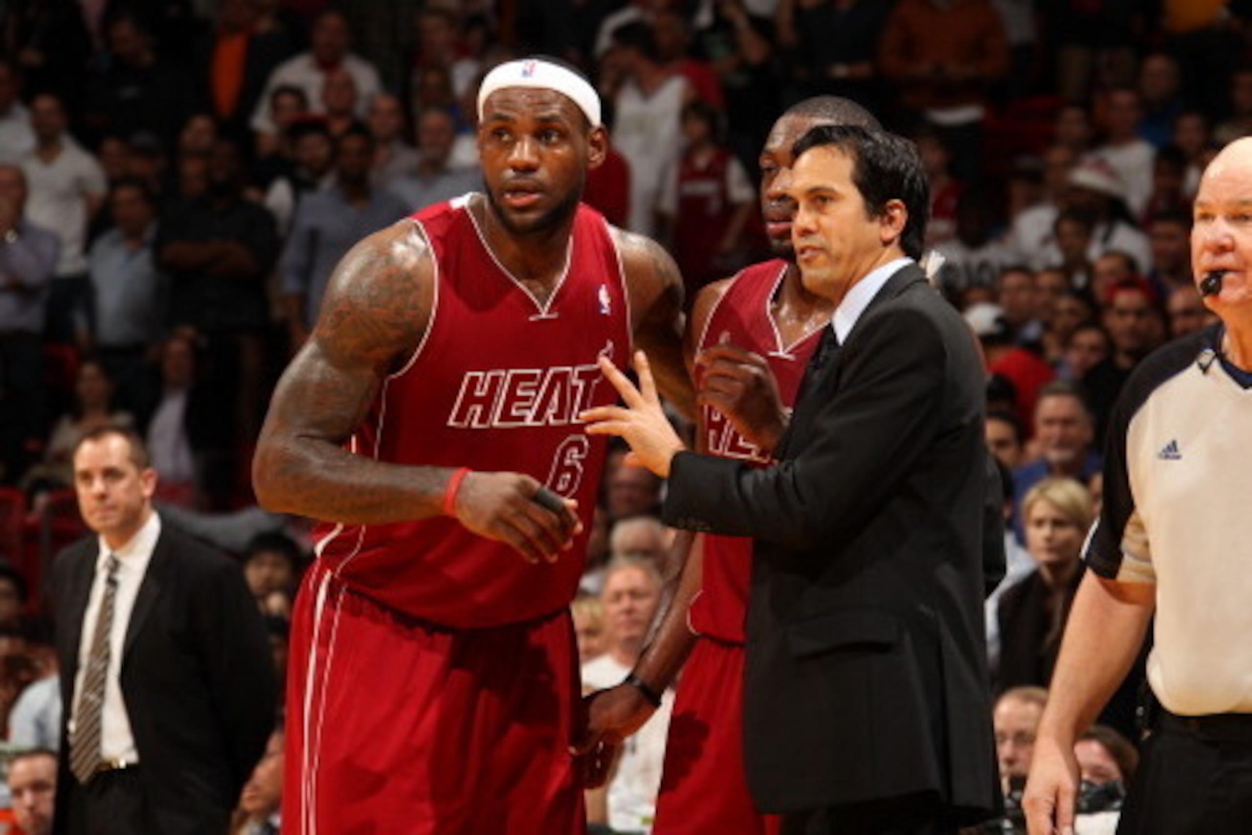 MIAMI, FL - DECEMBER 18: Erik Spoelstra of the Miami Heat shares a word with LeBron James #6 during the game the game against the Indiana Pacers on December 18, 2013 at American Airlines Arena in Miami, Florida. NOTE TO USER: User expressly acknowledges a