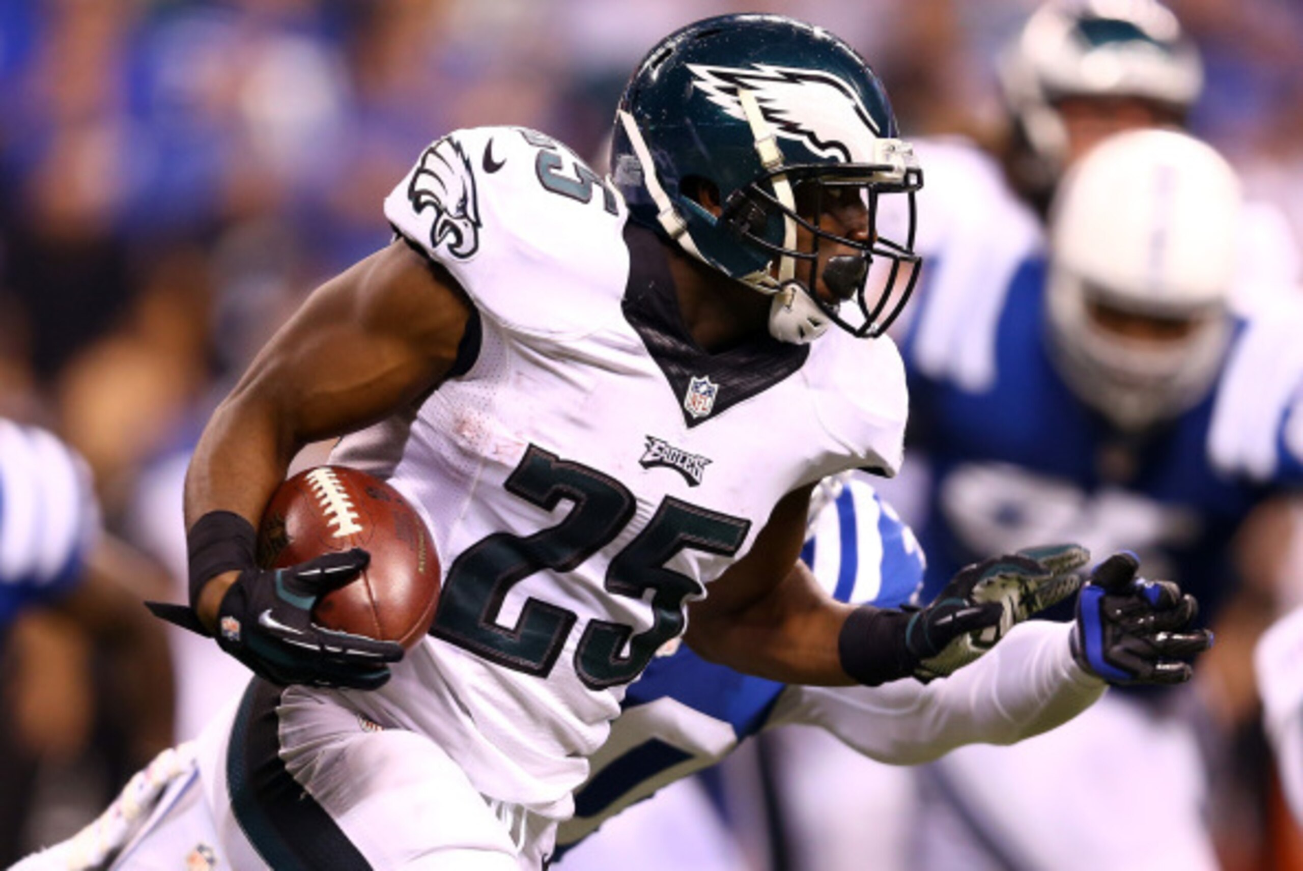 INDIANAPOLIS, IN - SEPTEMBER 15:  Running back LeSean McCoy #25 of the Philadelphia Eagles carries the ball as free safety LaRon Landry #30 of the Indianapolis Colts defends during a game at Lucas Oil Stadium on September 15, 2014 in Indianapolis, Indiana