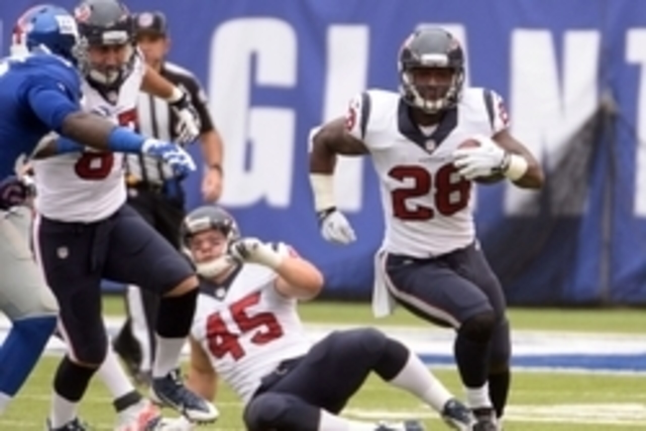 Sep 21, 2014; East Rutherford, NJ, USA; Houston Texans running back Alfred Blue (28) rushes the ball during the first quarter against the New York Giants at MetLife Stadium. Mandatory Credit: Robert Deutsch-USA TODAY Sports
