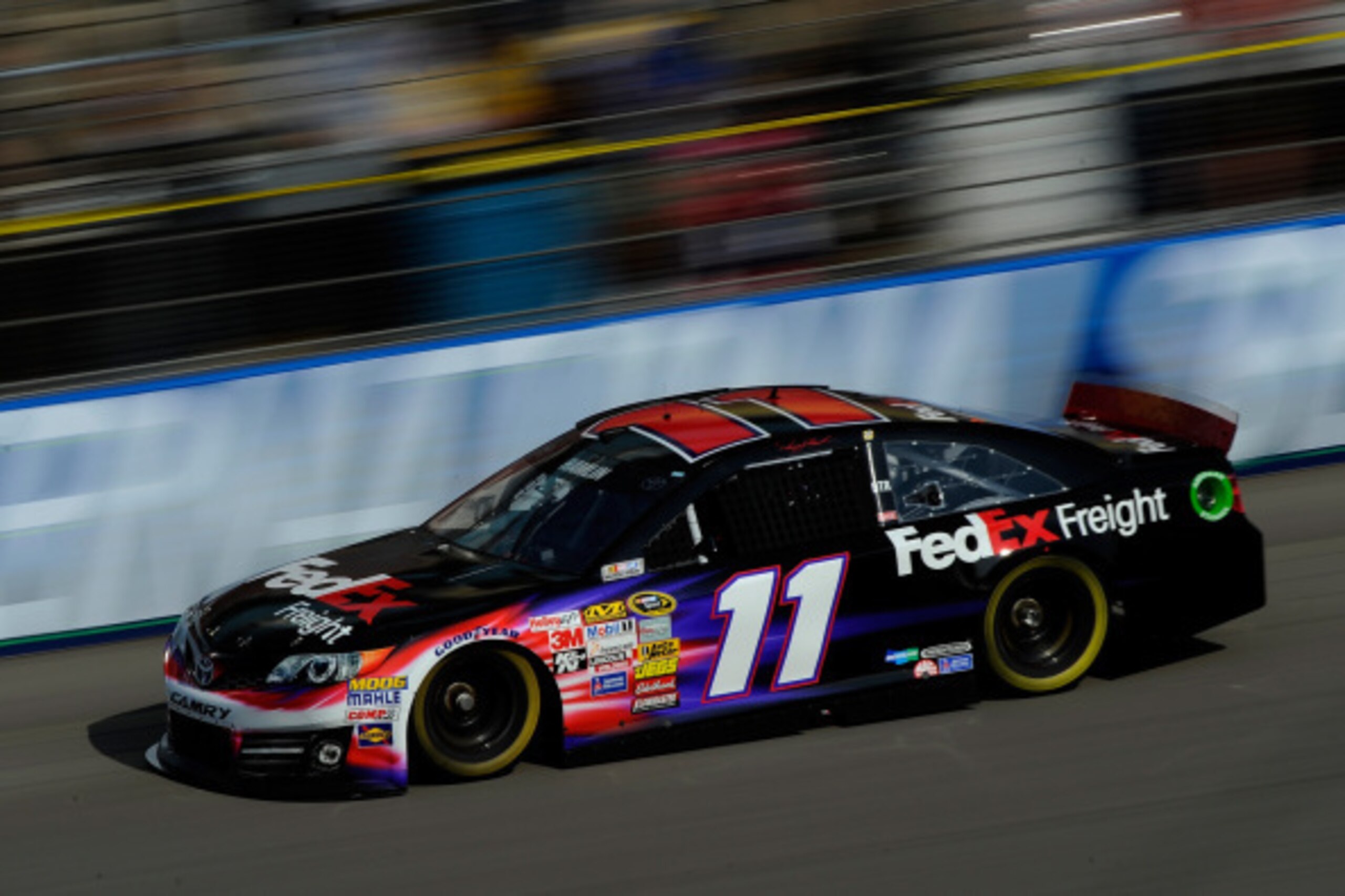 BROOKLYN, MI - AUGUST 16:  Denny Hamlin, driver of the #11 FedEx Freight Toyota, on track during practice for the NASCAR Sprint Cup Series Pure Michigan 400 at Michigan International Speedway on August 16, 2014 in Brooklyn, Michigan.  (Photo by Jared C. T
