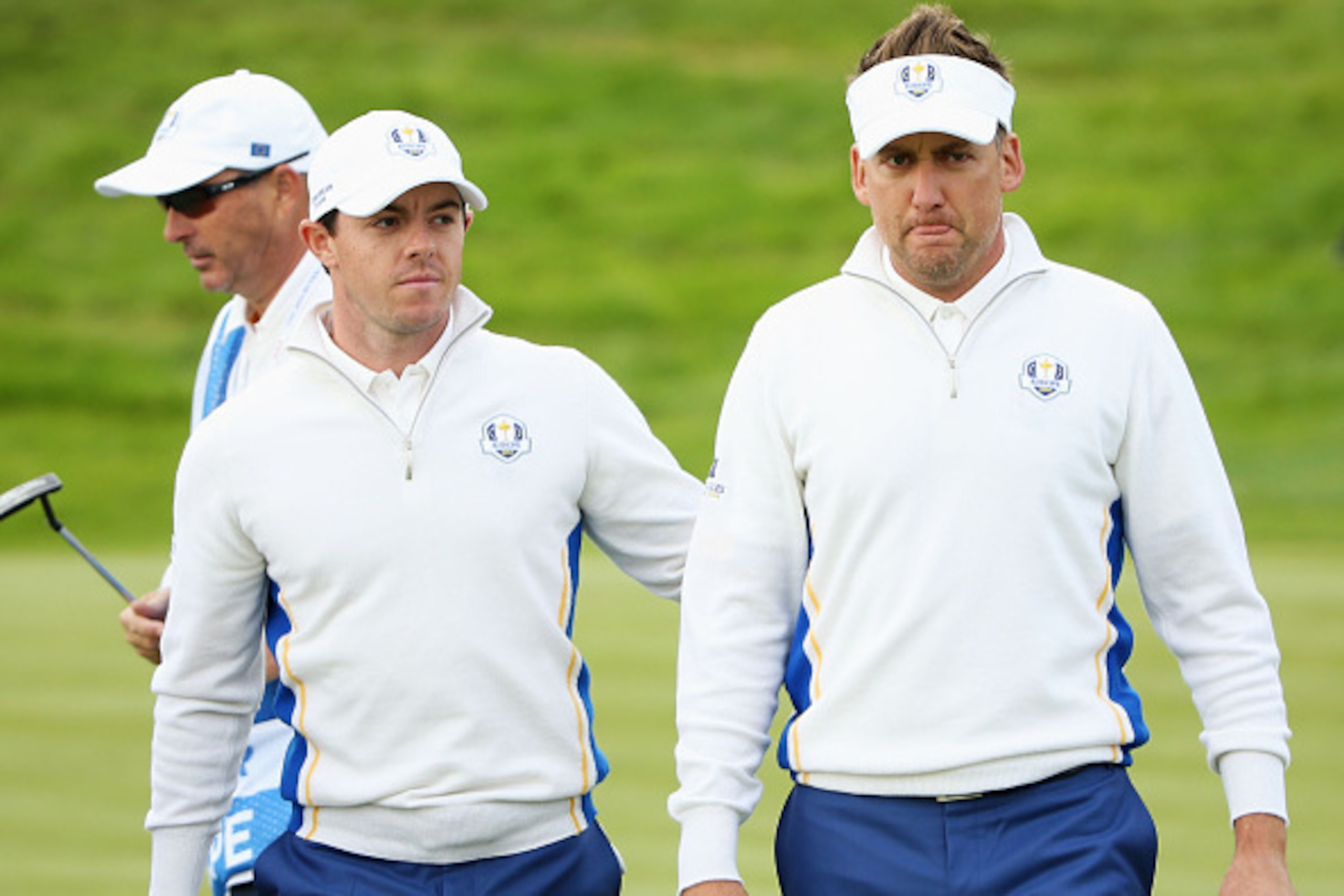 AUCHTERARDER, SCOTLAND - SEPTEMBER 27:  Rory McIlroy (L) of Europe congratulates Ian Poulter of Europe after his birdie on the 16th hole during the Morning Fourballs of the 2014 Ryder Cup on the PGA Centenary course at the Gleneagles Hotel on September 27