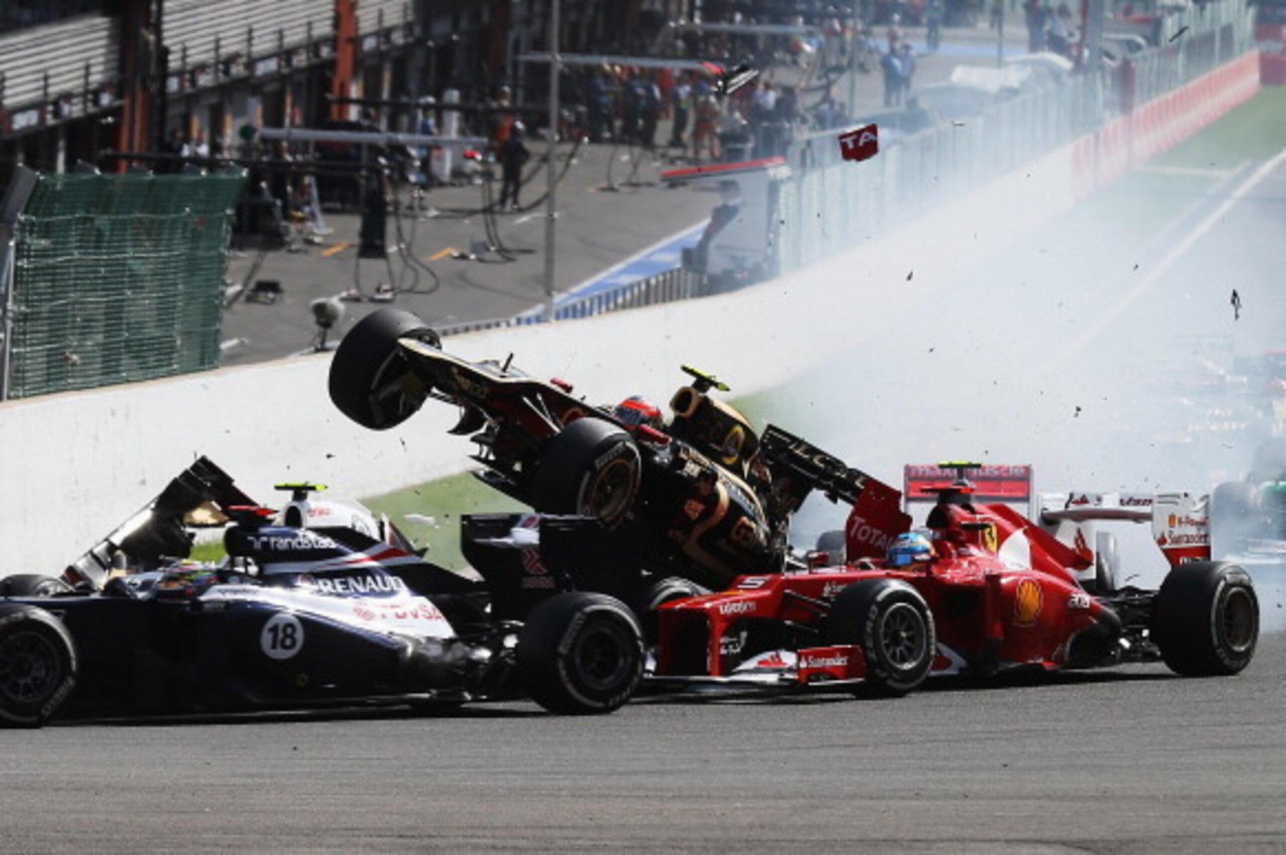 SPA, BELGIUM - SEPTEMBER 02:  In this sequence of ten frames Romain Grosjean of France and Lotus is seen being catapulted into the air as he crashes at the first corner at the start of the Belgian Grand Prix at the Circuit of Spa Francorchamps on Septembe