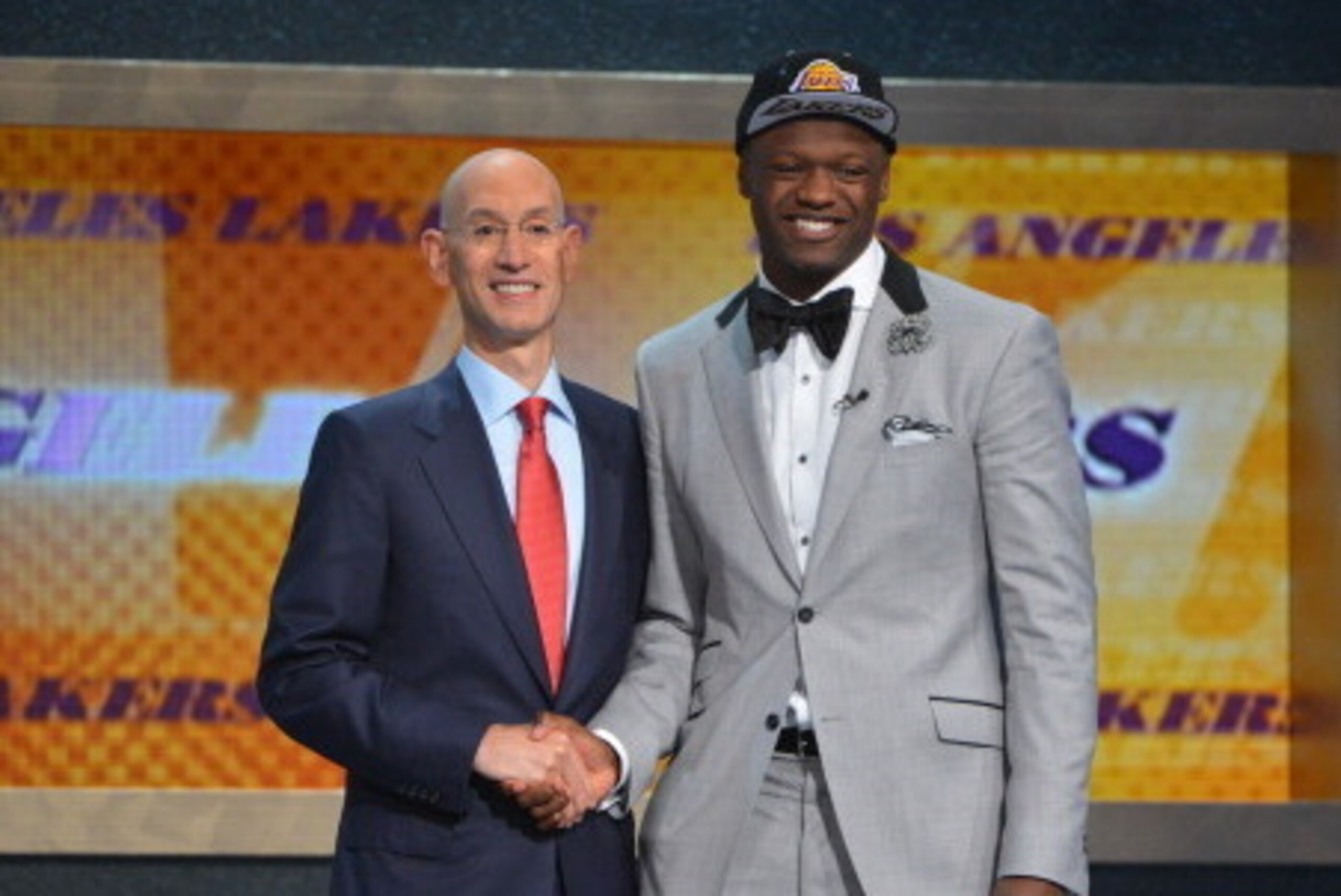 BROOKLYN, NY - JUNE 26: Julius Randle shakes hands with NBA Commissioner Adam Silver after being selected number seven overall by the Los Angeles Lakers during the 2014 NBA Draft on June 26, 2014 at Barclays Center in Brooklyn, New York. NOTE TO USER: Use
