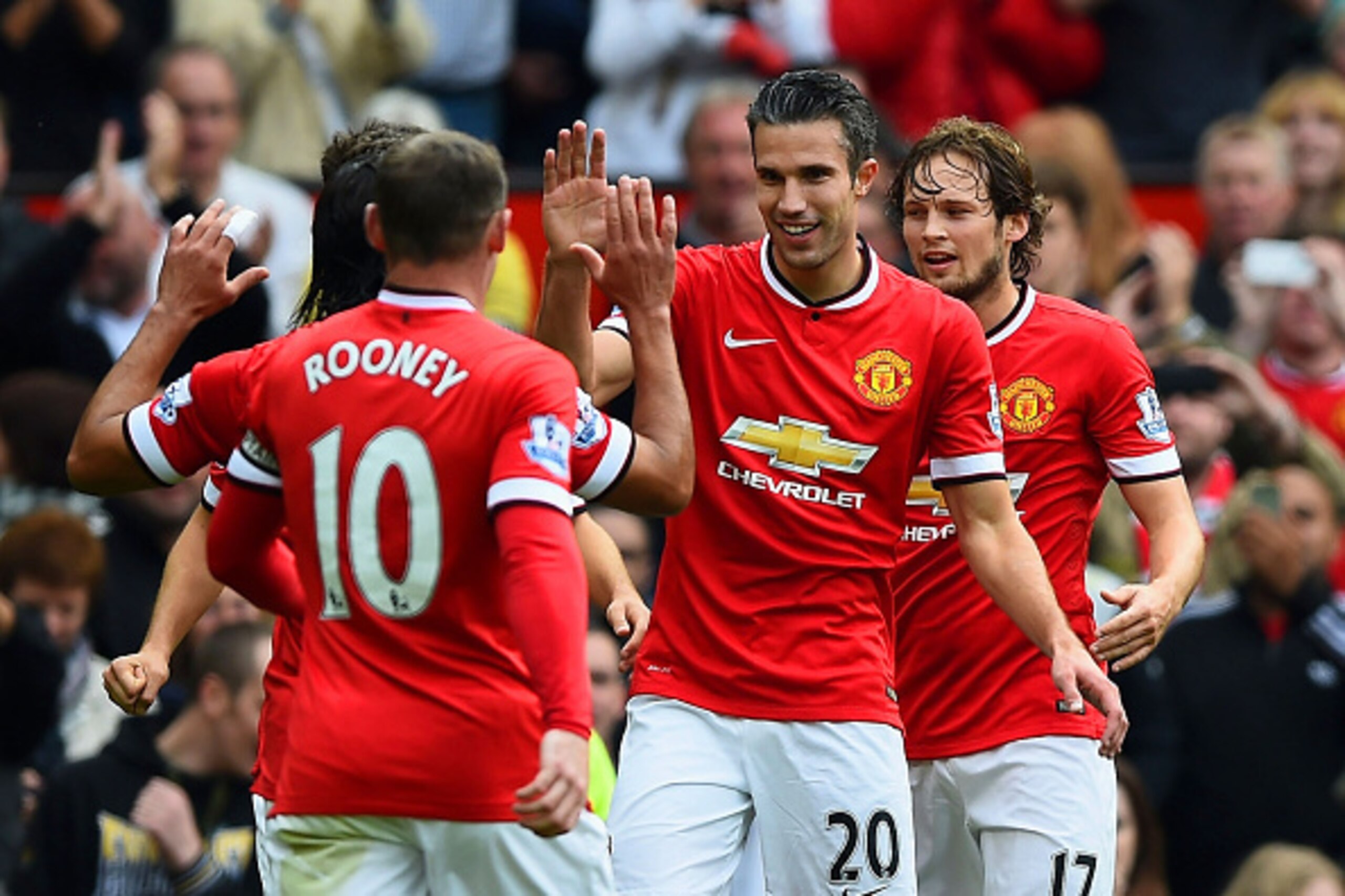 MANCHESTER, ENGLAND - SEPTEMBER 27: Robin van Persie #20 of Manchester United celebrates with teammates after scoring his team's second goal during the Barclays Premier League match between Manchester United and West Ham United at Old Trafford on Septemb MANCHESTER, ENGLAND - SEPTEMBER 27: Robin van Persie #20 of Manchester United celebrates with teammates after scoring his team's second goal during the Barclays Premier League match between Manchester United and West Ham United at Old Trafford on Septemb