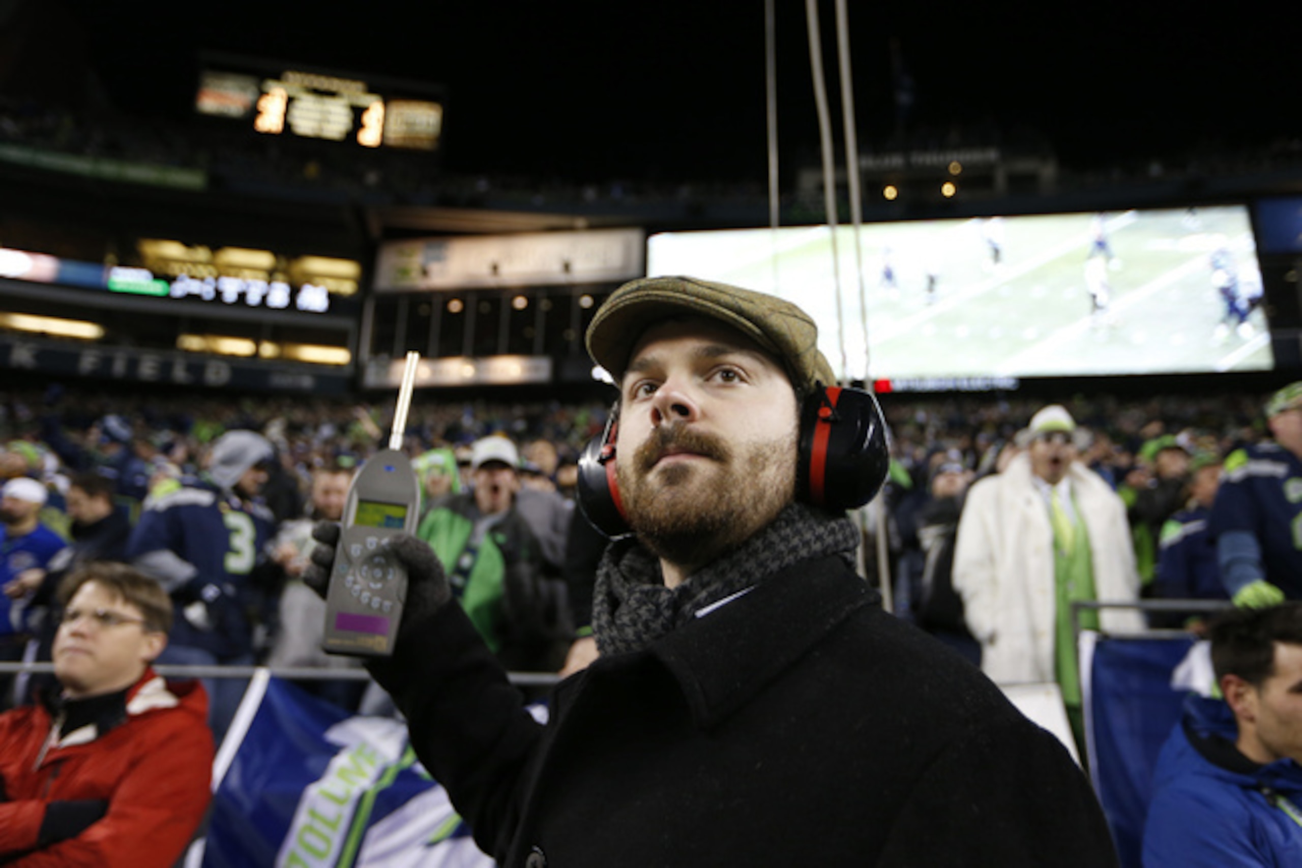 A crew member from the Guinness World Records is set up at CenturyLink Field to measure how loud Seahawks fans are. Dec. 2, 2013.