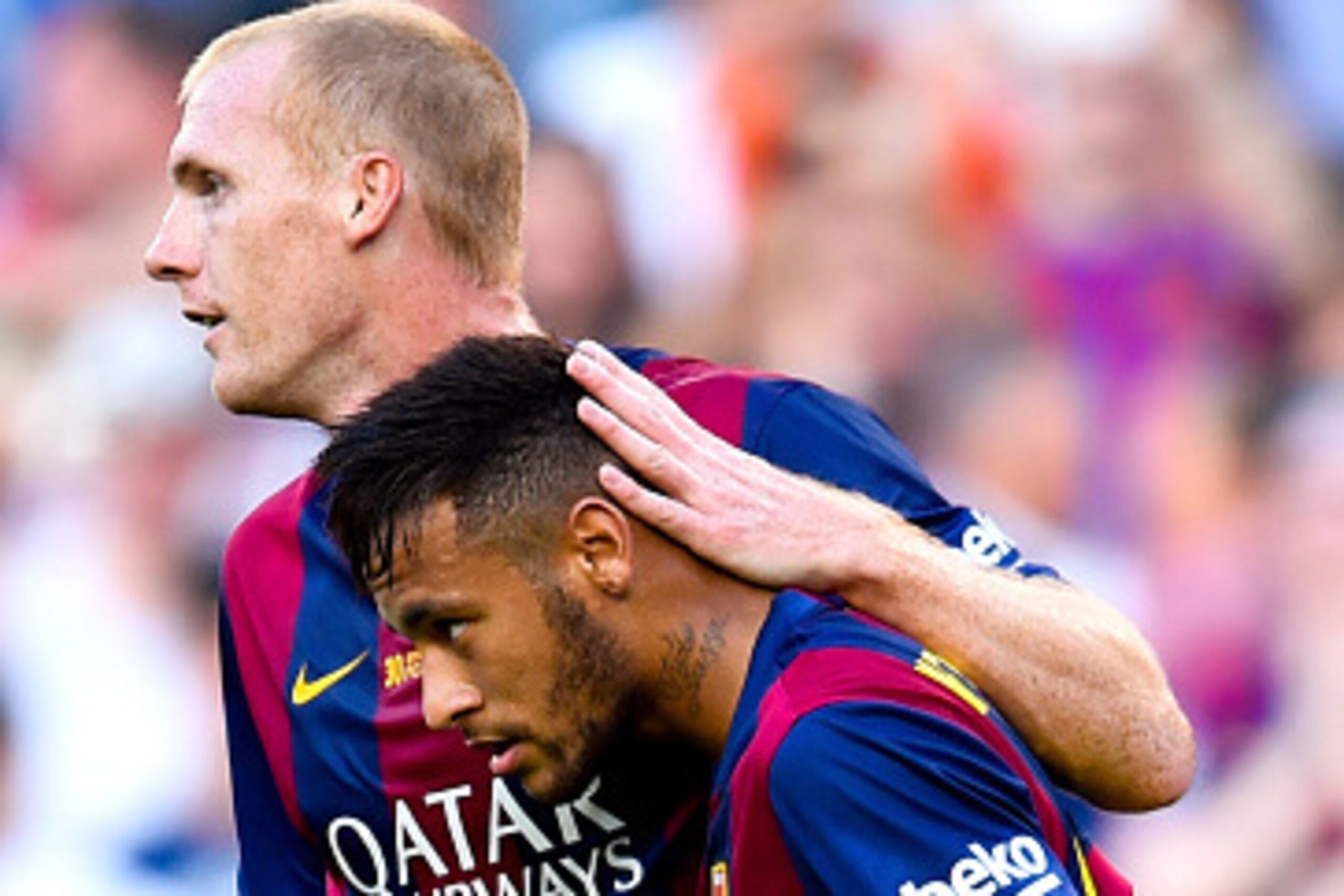 BARCELONA, SPAIN - SEPTEMBER 27:  Neymar of FC Barcelona celebrates with his team-mate Jeremy Mathieu of FC Barcelona after scoring the opening goal during the La Liga match between FC Barcelona and Granada CF at Camp Nou on September 27, 2014 in Barcelon