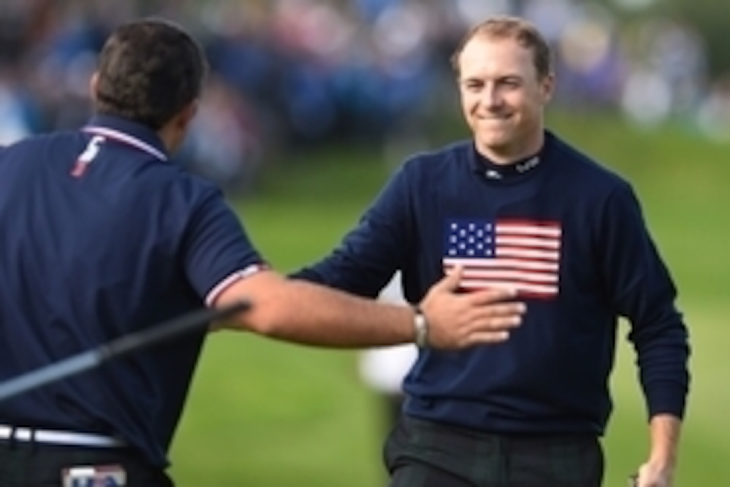 Sep 27, 2014; Gleneagles, Perthshire, SCT; American golfer Patrick Reed (L) celebrates with golfer Jordan Speith (R) on the 15th during their match on day two of the 2014 Ryder Cup at Gleneagles Resort - PGA Centenary Course. Mandatory Credit: Ian Rutherf