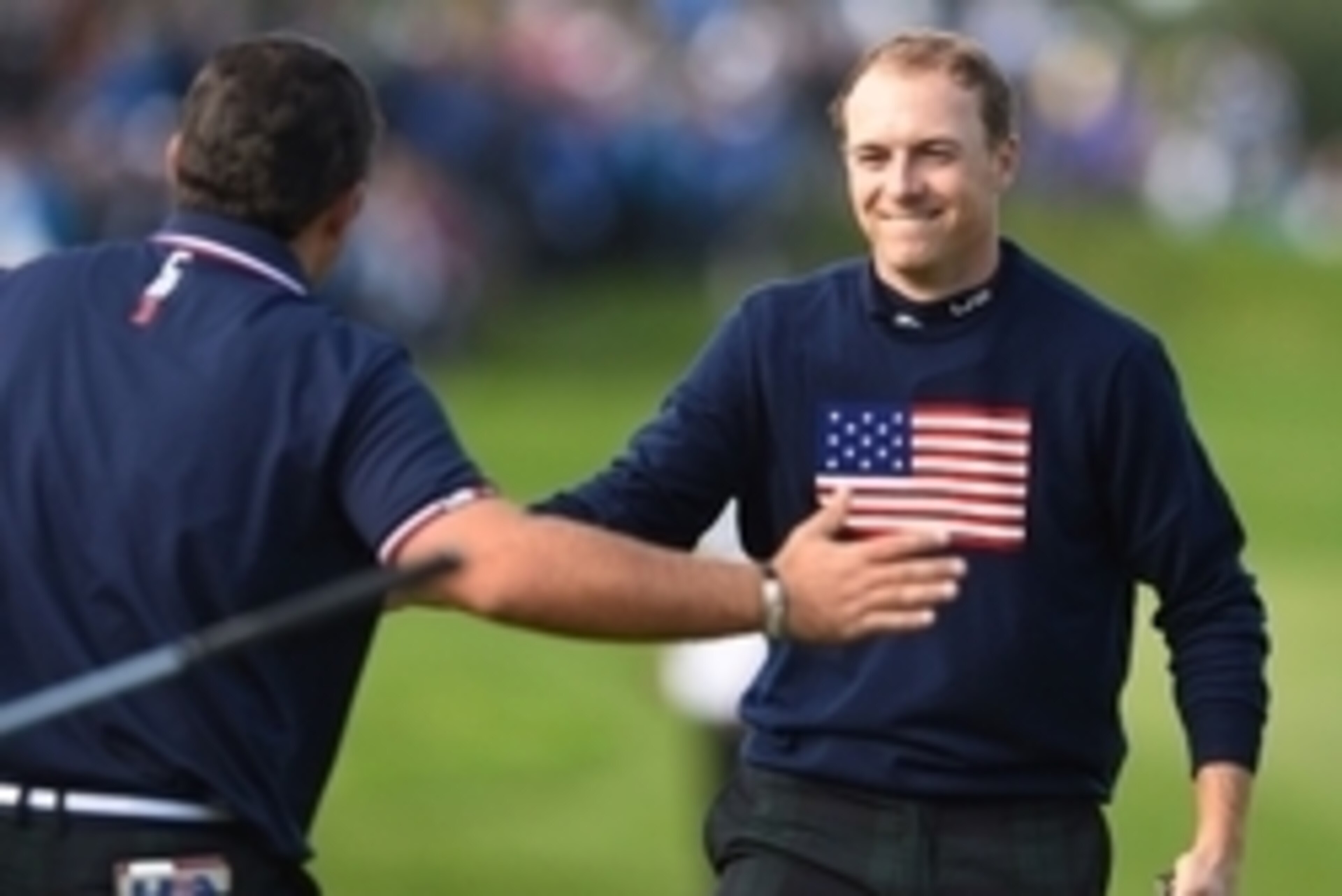 Sep 27, 2014; Gleneagles, Perthshire, SCT; American golfer Patrick Reed (L) celebrates with golfer Jordan Speith (R) on the 15th during their match on day two of the 2014 Ryder Cup at Gleneagles Resort - PGA Centenary Course. Mandatory Credit: Ian Rutherf
