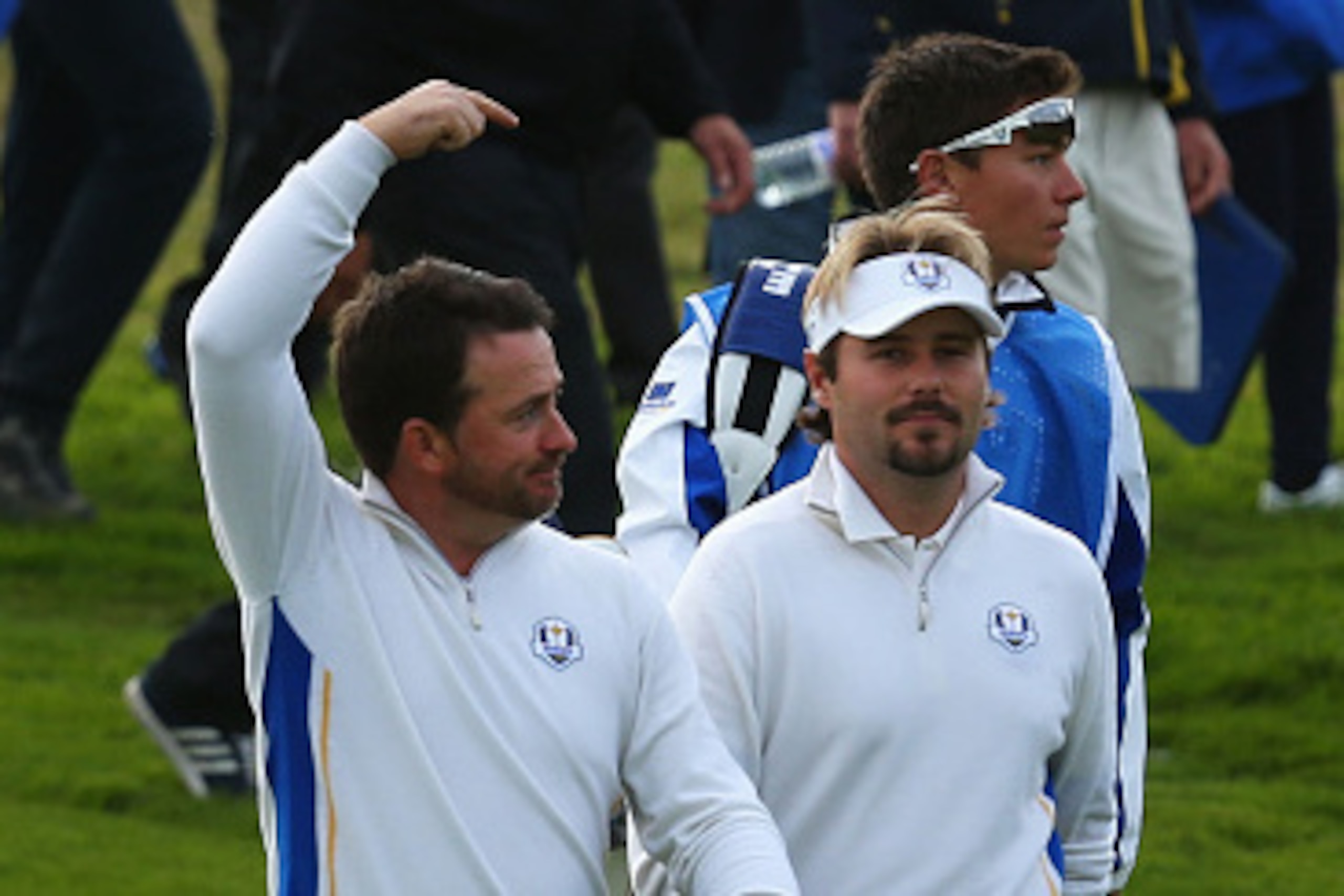 AUCHTERARDER, SCOTLAND - SEPTEMBER 27:  Graeme McDowell of Europe (L) points at playing partner Victor Dubuisson of Europe following their victory during the Afternoon Foursomes of the 2014 Ryder Cup on the PGA Centenary course at the Gleneagles Hotel on 