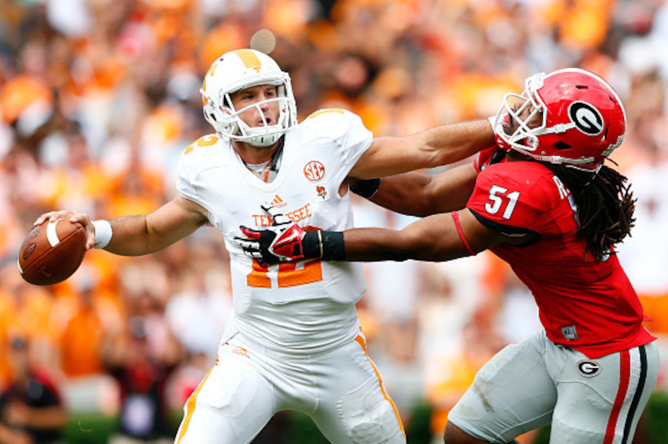 ATHENS, GA - SEPTEMBER 27:  Ramik Wilson #51 of the Georgia Bulldogs pressures Nathan Peterman #12 of the Tennessee Volunteers at Sanford Stadium on September 27, 2014 in Athens, Georgia.  (Photo by Kevin C. Cox/Getty Images)