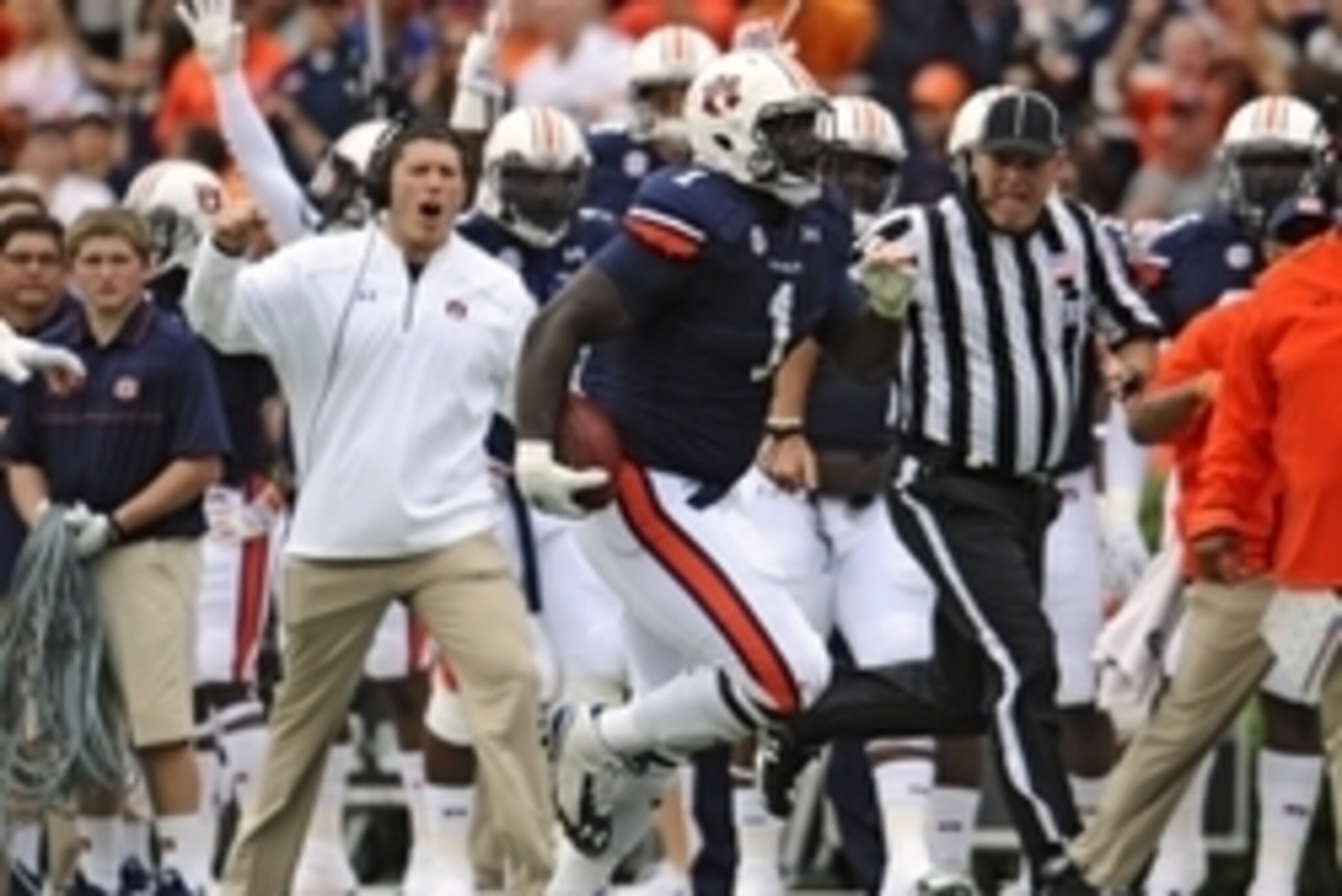 Sep 27, 2014; Auburn, AL, USA; Auburn Tigers defensive tackle Montravius Adams (1) runs the ball after an interception during the first half against the Louisiana Tech Bulldogs at Jordan Hare Stadium. Mandatory Credit: Shanna Lockwood-USA TODAY Sports