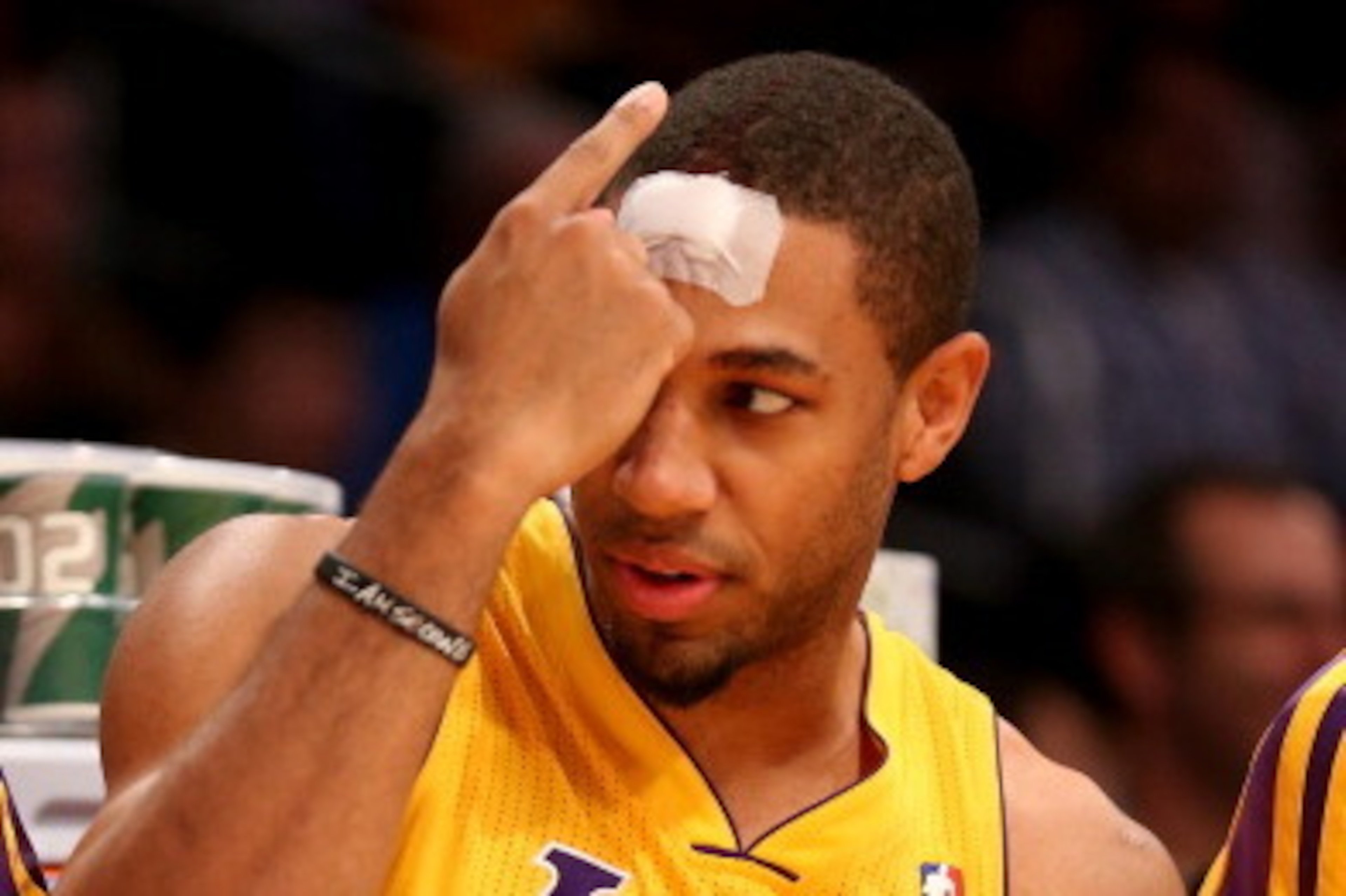 LOS ANGELES, CA - NOVEMBER 01: Xavier Henry #7 of the Los Angeles Lakers gestures to teammates on the bench after he receives a bandage for a cut on the forehead in the game with the San Antonio Spurs at Staples Center on November 1, 2013 in Los Angeles, LOS ANGELES, CA - NOVEMBER 01: Xavier Henry #7 of the Los Angeles Lakers gestures to teammates on the bench after he receives a bandage for a cut on the forehead in the game with the San Antonio Spurs at Staples Center on November 1, 2013 in Los Angeles,