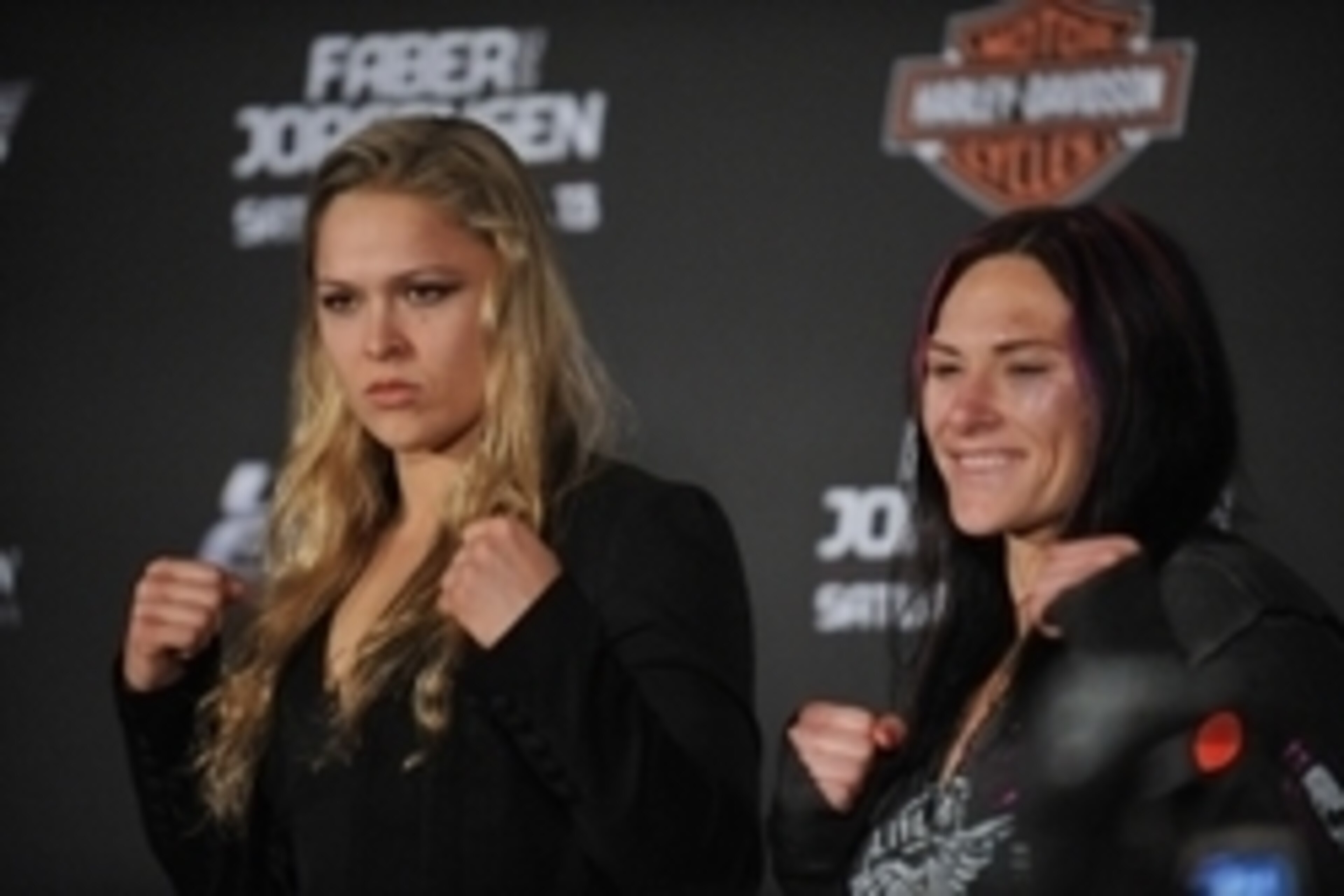 April 13, 2013; Las Vegas, NV, USA; Ronda Rousey (left) poses for photographs with Cat Zingano following the TUF 17 Finale at the Mandalay Bay Events Center. Mandatory Credit: Gary A. Vasquez-USA TODAY Sports