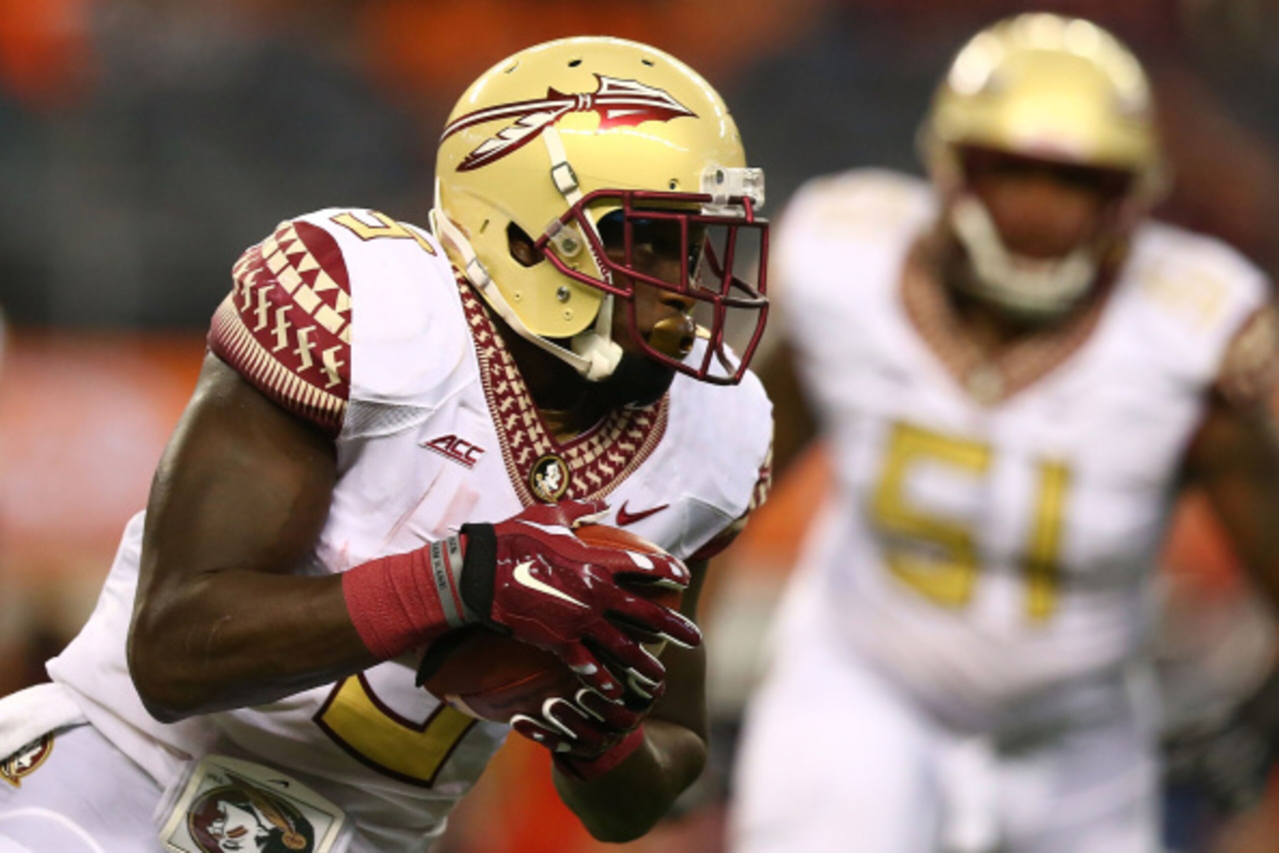 ARLINGTON, TX - AUGUST 30:  Karlos Williams #9 of the Florida State Seminoles rushes against the Oklahoma State Cowboys in the first half of the Advocare Cowboys Classic at AT&T Stadium on August 30, 2014 in Arlington, Texas.  (Photo by Ronald Martinez/Ge