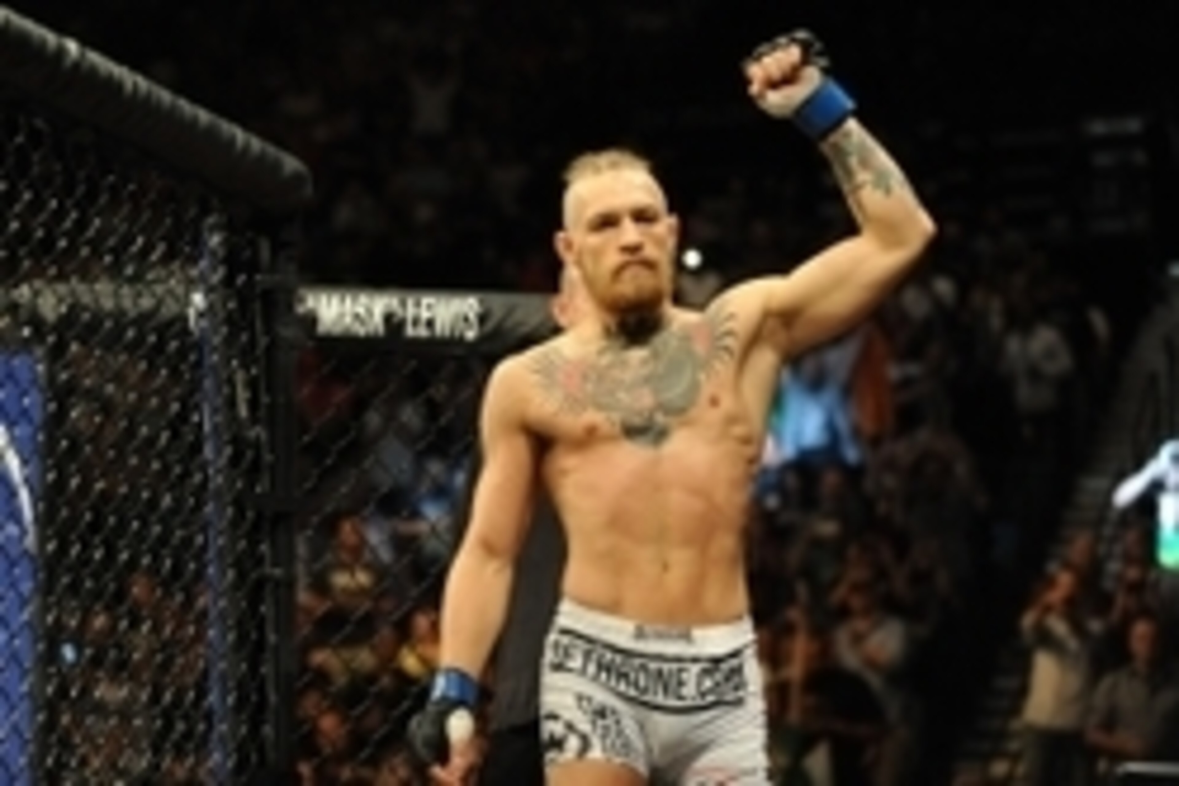 Sep 27, 2014; Las Vegas, NV, USA; Conor McGregor enters the octagon ready for a featherweight fight against Dustin Poirier during UFC 178 at MGM Grand Garden Arena. Mandatory Credit: Stephen R. Sylvanie-USA TODAY Sports