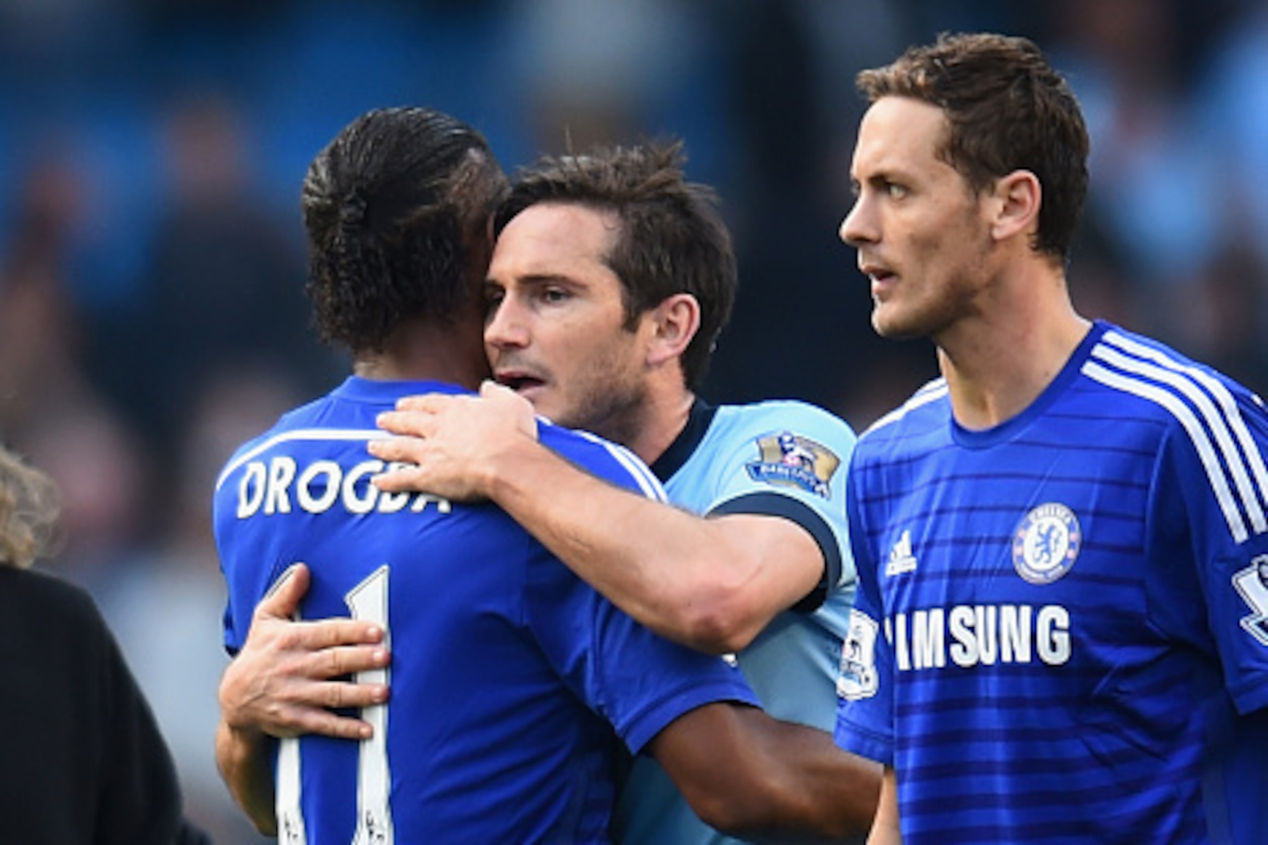 MANCHESTER, ENGLAND - SEPTEMBER 21:  Frank Lampard of Manchester City embraces Didier Drogba of Chelsea at the end of the Barclays Premier League match between Manchester City and Chelsea at the Etihad Stadium on September 21, 2014 in Manchester, England.