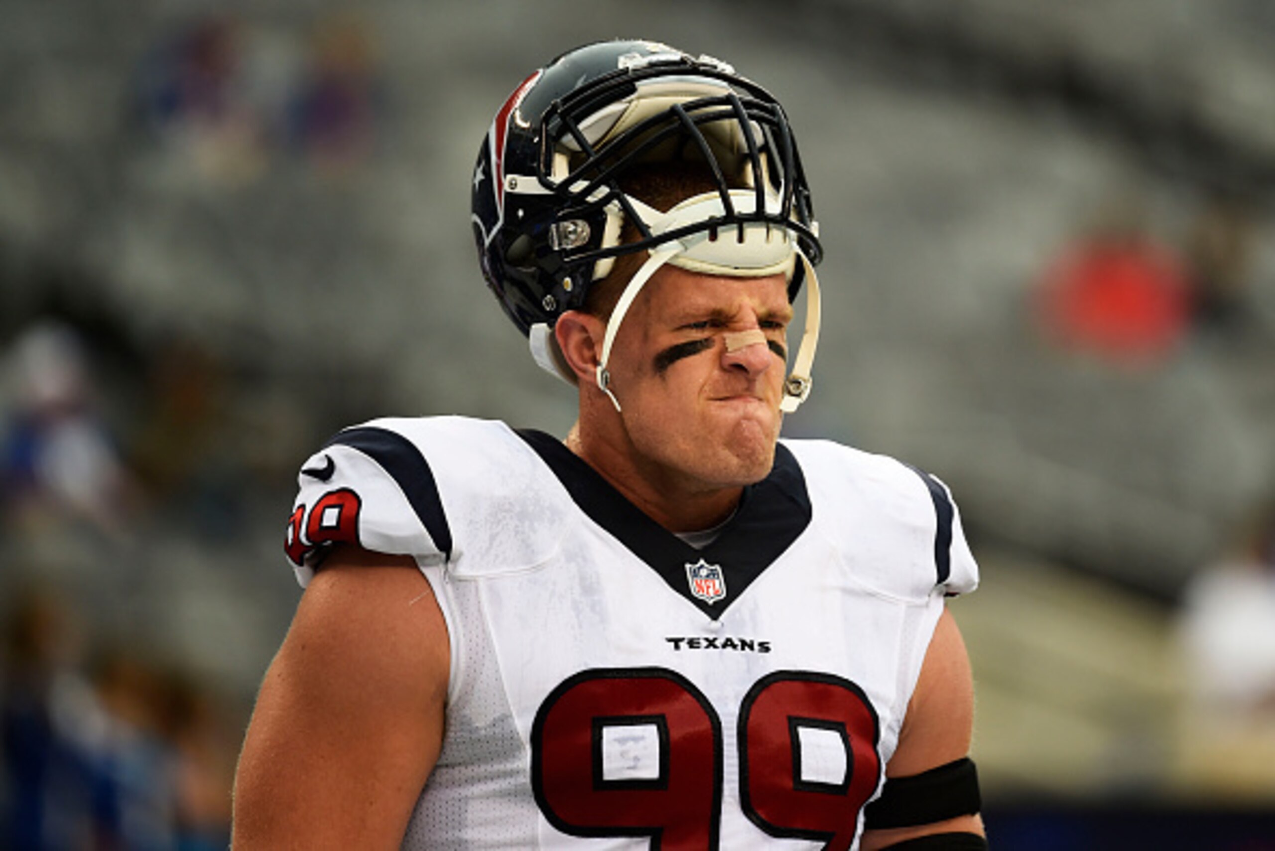 EAST RUTHERFORD, NJ - SEPTEMBER 21:  J.J. Watt #99 of the Houston Texans looks on during warm ups prior to their game against the New York Giants at MetLife Stadium on September 21, 2014 in East Rutherford, New Jersey.  (Photo by Alex Goodlett/Getty Image