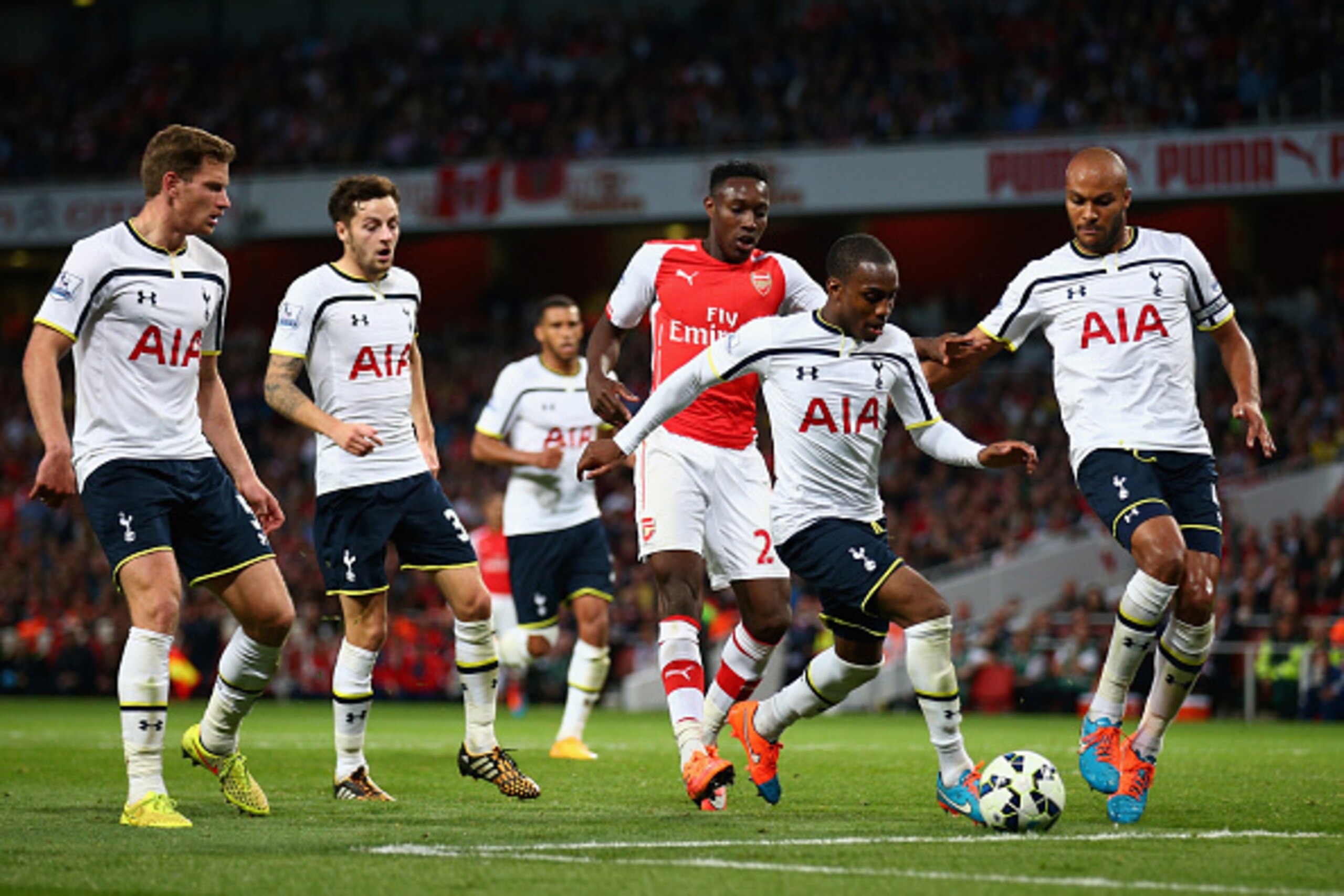 LONDON, ENGLAND - SEPTEMBER 27:  Danny Rose of Tottenham Hotspur takes the ball away from Danny Welbeck of Arsenal during the Barclays Premier League match between Arsenal and Tottenham Hotspur at Emirates Stadium on September 27, 2014 in London, England.