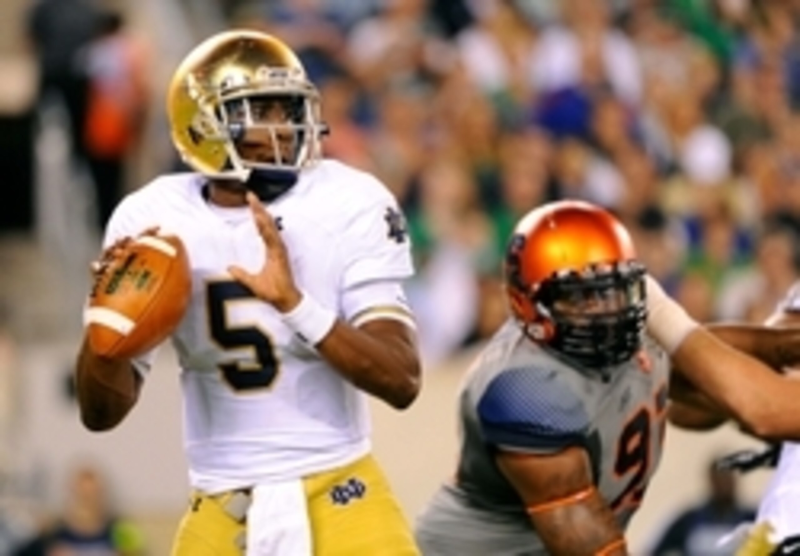 Sep 27, 2014; East Rutherford, NJ, USA; Notre Dame Fighting Irish quarterback Everett Golson (5) drops back to pass against the Syracuse Orange during the third quarter at MetLife Stadium.  Notre Dame defeated Syracuse 31-15.  Mandatory Credit: Rich Barne