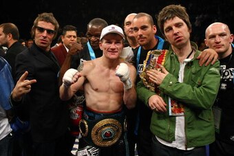 LAS VEGAS - NOVEMBER 22:  (L-R) Liam Gallagher of Oasis, Ricky Hatton of England, Noel Gallagher of Oasis and boxer Matthew Hatton celebrate Ricky Hatton's 11th round TKO victory against Paulie Malignaggi after their light-welterweight fight at the MGM Gr