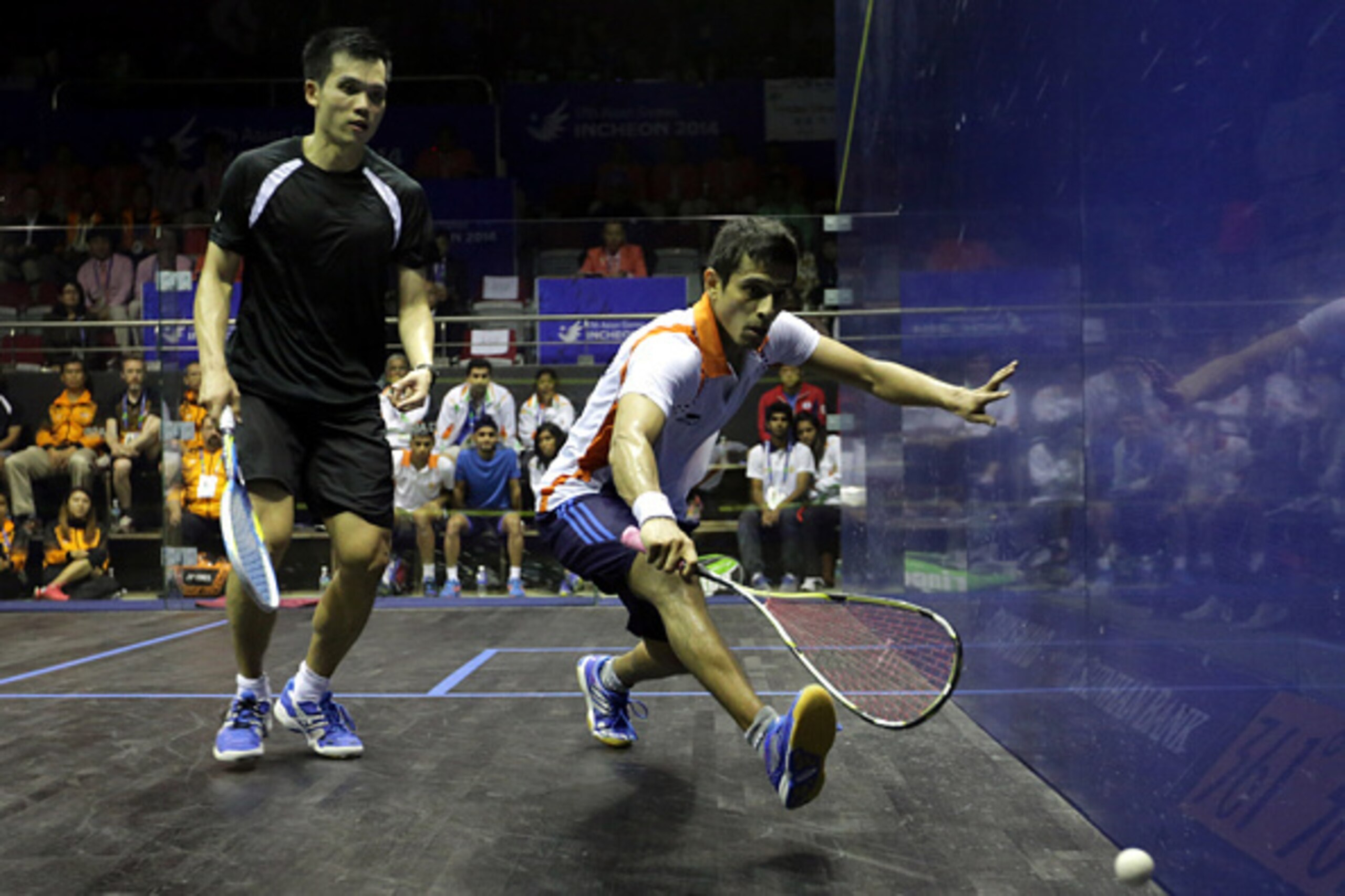 INCHEON, SOUTH KOREA - SEPTEMBER 27:  Saurauv Ghosal (R) of India and Ong Beng Hee of Malaysia compete during Squash Mens Team Final during day eight of the 2014 Asian Games at Yeorumul Squash Courts on September 27, 2014 in Incheon, South Korea.  (Photo 