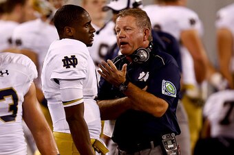 EAST RUTHERFORD, NJ - SEPTEMBER 27: Notre Dame Fighting Irish head coach Brian Kelly talks with Everett Golson #5 during their game against the Syracuse Orange at MetLife Stadium September 27, 2014 in East Rutherford, New Jersey. (Photo by Jeff Zelevansky