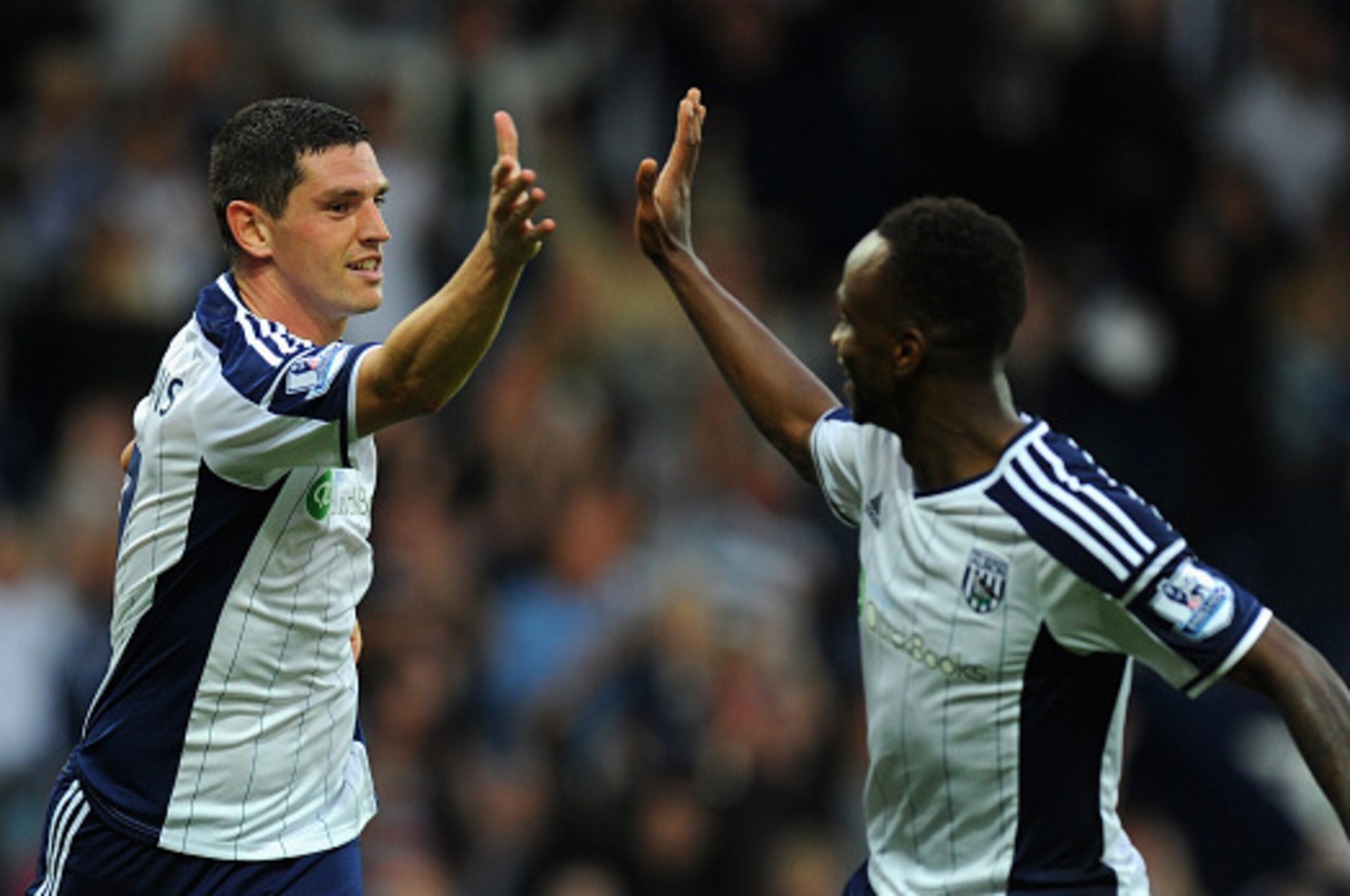 WEST BROMWICH, ENGLAND - SEPTEMBER 28:  WBA goalscorer Graham Dorrans (l) celebrates his goal with  Saido Berahino during the Barclays Premier League match between West Bromwich Albion and Burnley at The Hawthorns on September 28, 2014 in West Bromwich, E