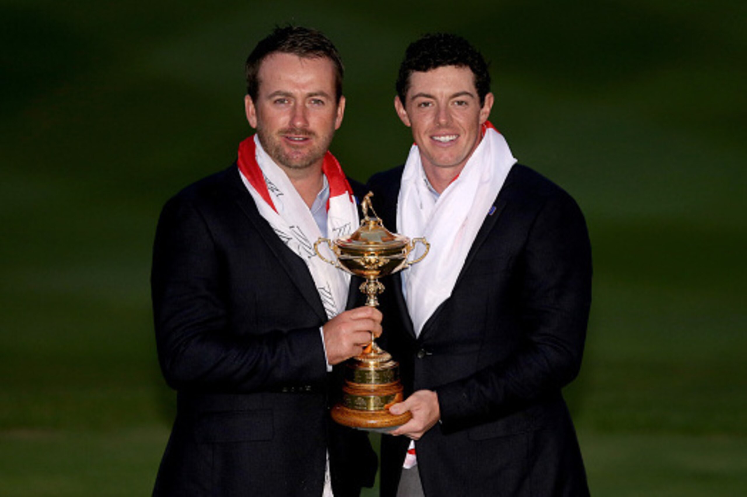 AUCHTERARDER, SCOTLAND - SEPTEMBER 28:  Graeme McDowell and Rory McIlroy of Europe pose with the Ryder Cup trophy after the Singles Matches of the 2014 Ryder Cup on the PGA Centenary course at the Gleneagles Hotel on September 28, 2014 in Auchterarder, Sc