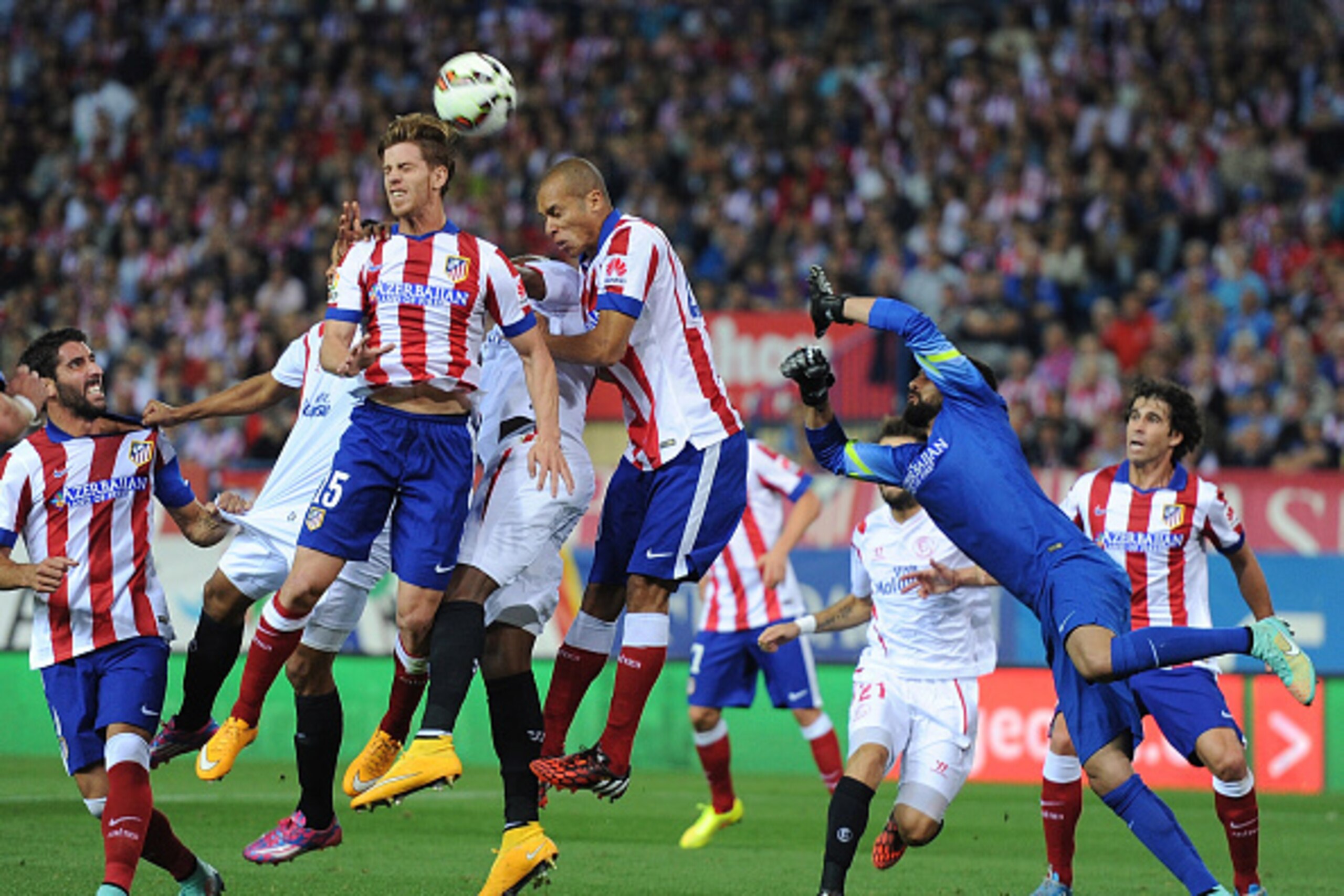 MADRID, SPAIN - SEPTEMBER 27:  Cristian Ansaldi of Club Atletico de Madrid heads the ball during a FC Sevilla free kick during the La Liga match between Club Atletico de Madrid and Sevilla FC at Vicente Calderon Stadium on September 27, 2014 in Madrid, Sp