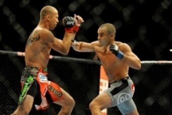 Sep 27, 2014; Las Vegas, NV, USA; Donald Cerrone (red gloves) fights Eddie Alvarez (blue gloves) during a lightweight fight at UFC 178 at MGM Grand Garden Arena. Mandatory Credit: Stephen R. Sylvanie-USA TODAY Sports