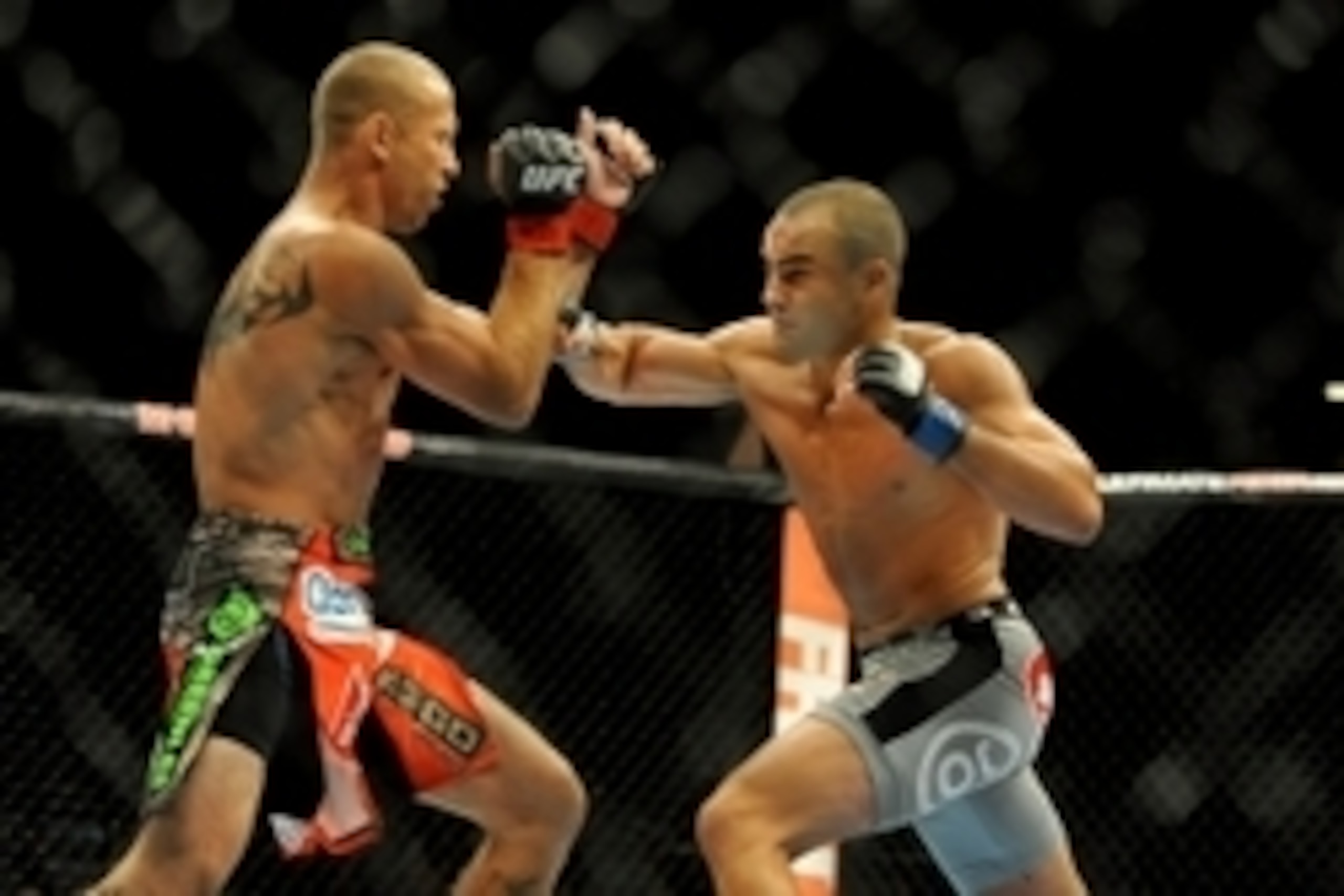 Sep 27, 2014; Las Vegas, NV, USA; Donald Cerrone (red gloves) fights Eddie Alvarez (blue gloves) during a lightweight fight at UFC 178 at MGM Grand Garden Arena. Mandatory Credit: Stephen R. Sylvanie-USA TODAY Sports