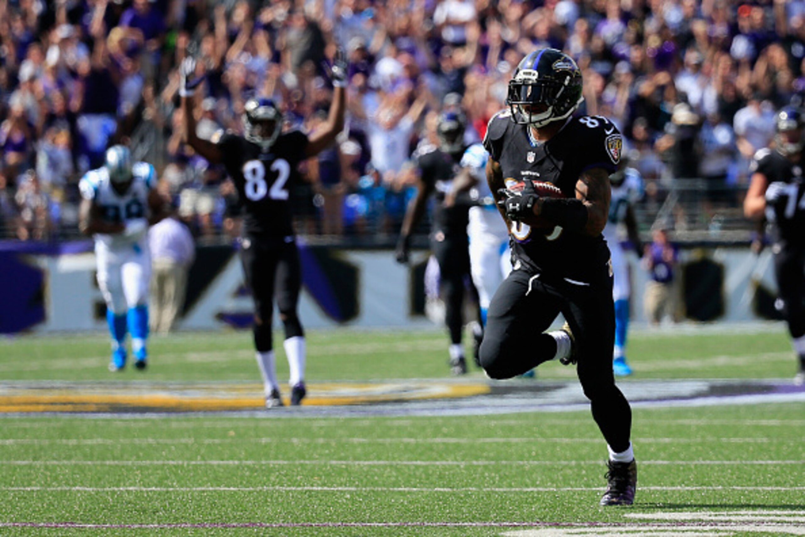 BALTIMORE, MD - SEPTEMBER 28:  Wide receiver Steve Smith #89 of the Baltimore Ravens scores a touchdown in the second quarter of a game against the Carolina Panthers at M&T Bank Stadium on September 28, 2014 in Baltimore, Maryland.  (Photo by Rob Carr/Get