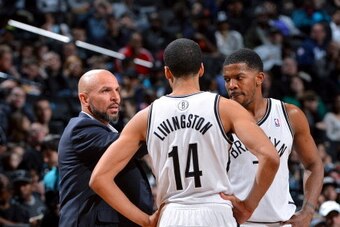 BROOKLYN, NY - MARCH 9: Shaun Livingston #14 and Joe Johnson #7 of the Brooklyn Nets talk to Head Coach Jason Kidd during their game against the Sacramento Kings on March 9, 2014 at the Barclays Center in Brooklyn, New York. NOTE TO USER: User expressly a