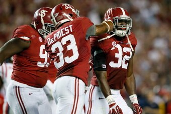 TUSCALOOSA, AL - SEPTEMBER 28:  Darren Lake #95, Trey DePriest #33 and C.J. Mosley #32 of the Alabama Crimson Tide react after a defensive stop against the Mississippi Rebels at Bryant-Denny Stadium on September 28, 2013 in Tuscaloosa, Alabama.  (Photo by