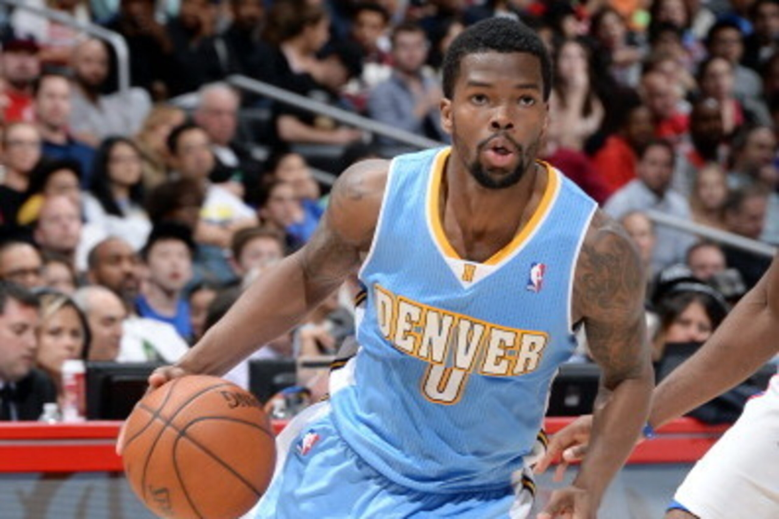 LOS ANGELES, CA - APRIL 15: Aaron Brooks #0 of the Denver Nuggets drives against the Los Angeles Clippers at Staples Center on April 15, 2014 in Los Angeles, California. NOTE TO USER: User expressly acknowledges and agrees that, by downloading and/or usin