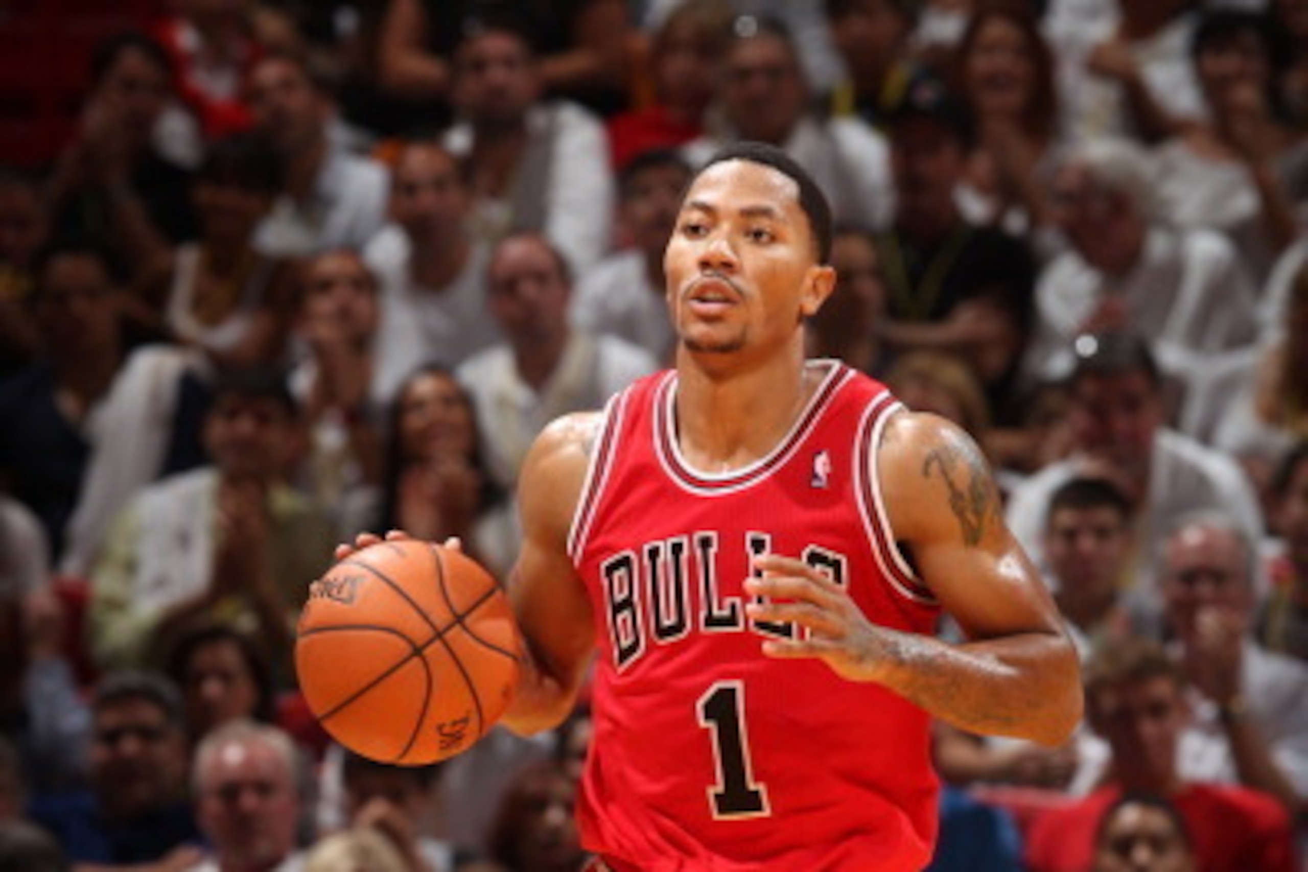 MIAMI, FL - OCTOBER 29: Derrick Rose #1 of the Chicago Bulls brings the ball up the court against the Miami Heat on October 29, 2013 at AmericanAirlines Arena in Miami, Florida. NOTE TO USER: User expressly acknowledges and agrees that, by downloading and