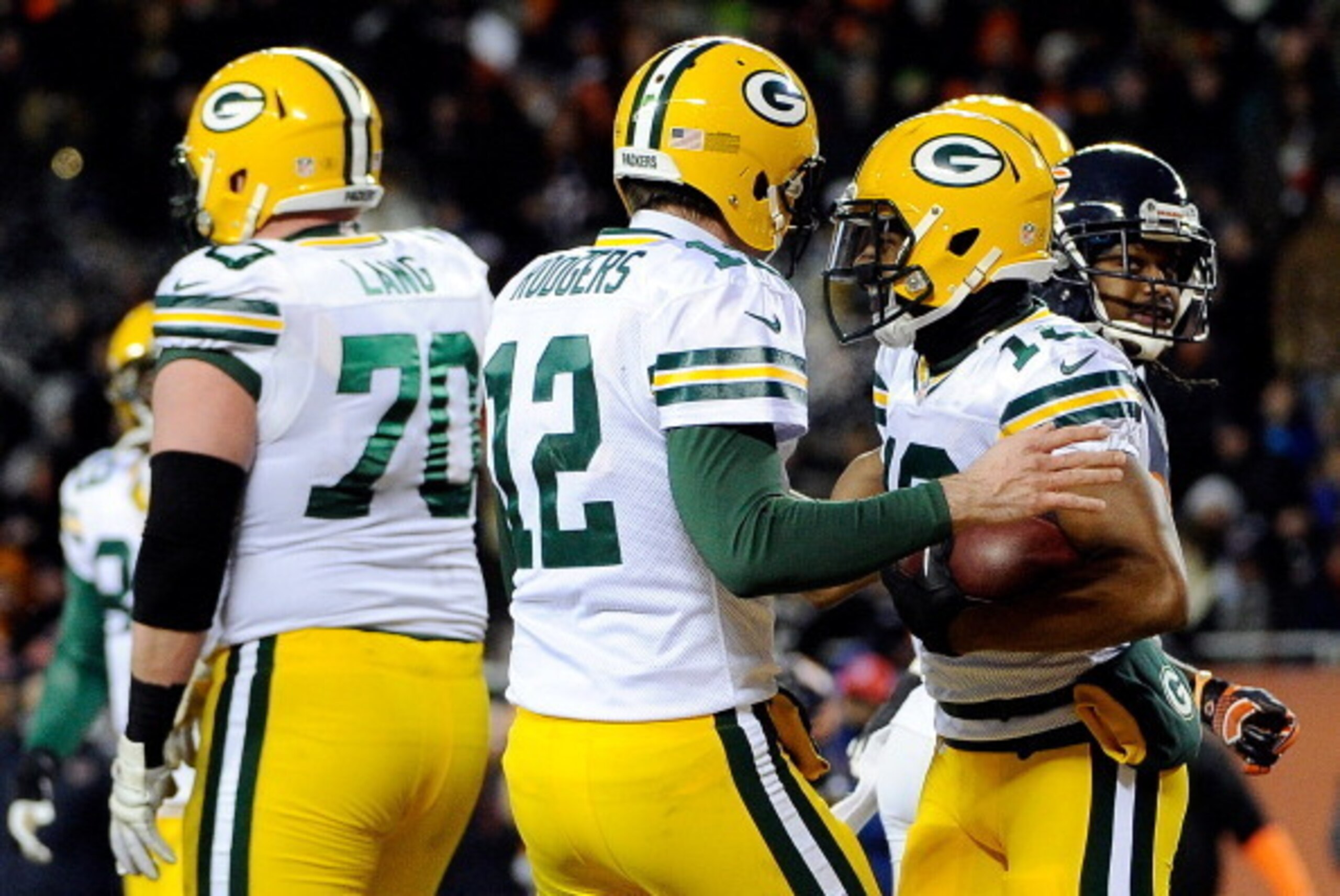CHICAGO, IL - DECEMBER 29: Wide receiver Randall Cobb #18 celebrates a third quarter touchdown with quarterback Aaron Rodgers #12 of the Green Bay Packers against the Chicago Bears during a game at Soldier Field on December 29, 2013 in Chicago, Illinois. 