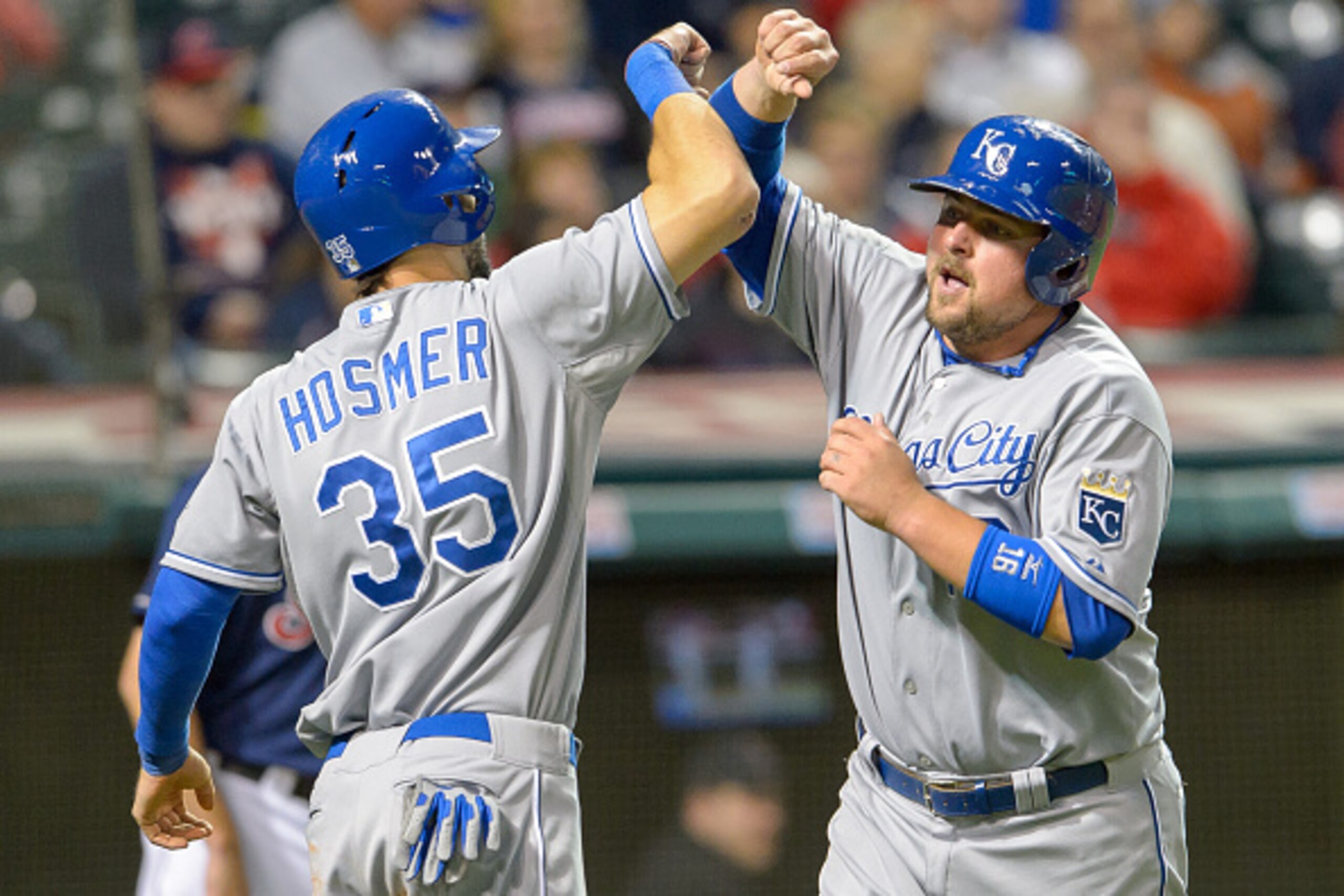 CLEVELAND, OH - SEPTEMBER 23:  Eric Hosmer #35 celebrates with Salvador Perez #13 of the Kansas City Royals after both scored on a double by Alex Gordon in the seventh inning against the Cleveland Indians at Progressive Field on September 23, 2014 in Clev