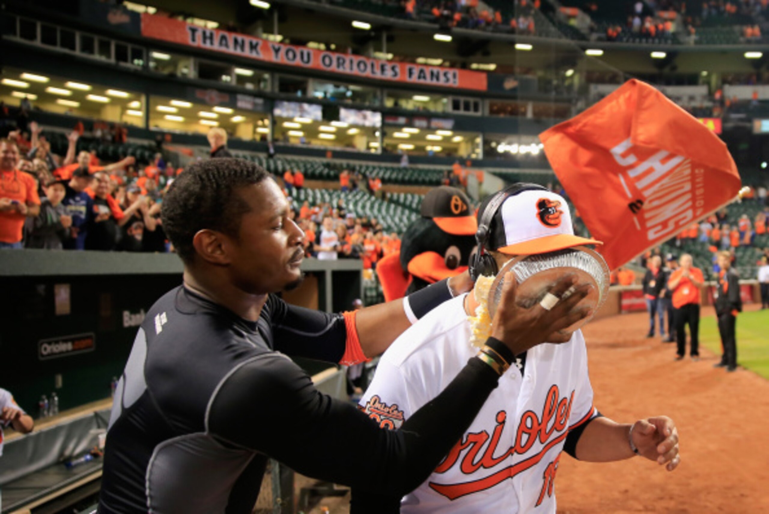 BALTIMORE, MD - SEPTEMBER 17:  Adam Jones #10 (L) hits teammate Christian Walker #18 of the Baltimore Orioles in the face with a pie after the Orioles defeated the Toronto Blue Jays 6-1 at Oriole Park at Camden Yards on September 17, 2014 in Baltimore, Ma